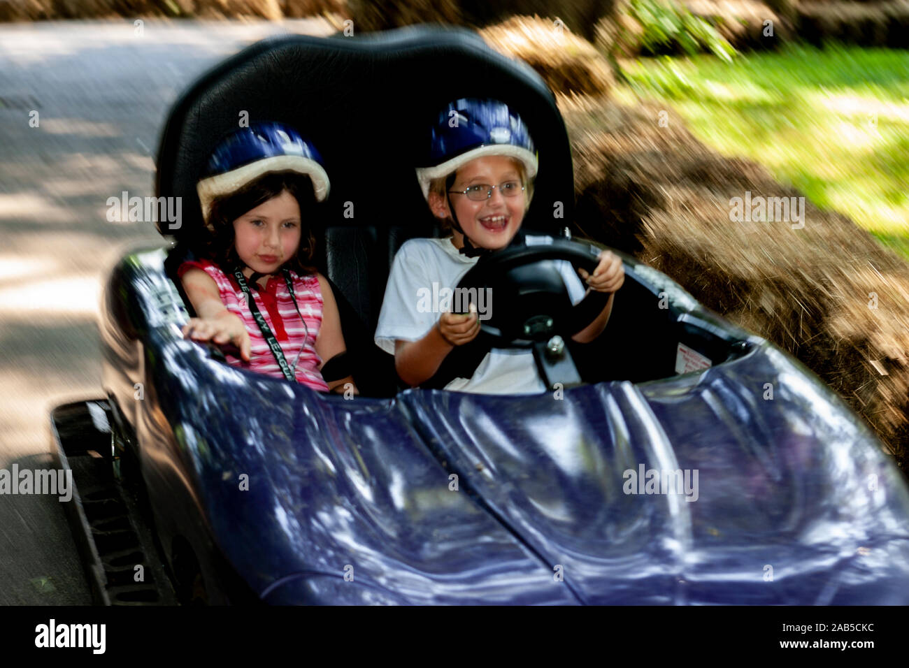 Girl go carting at day camp. Stock Photo