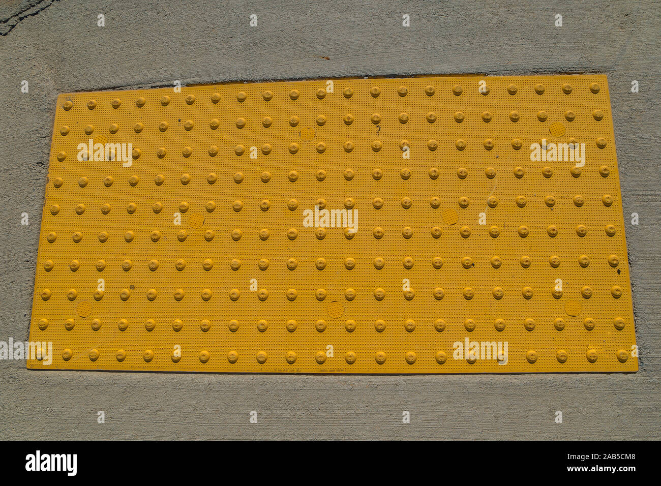 Yellow Safety Anti Slip Pad On The Sidewalk For Handicap And