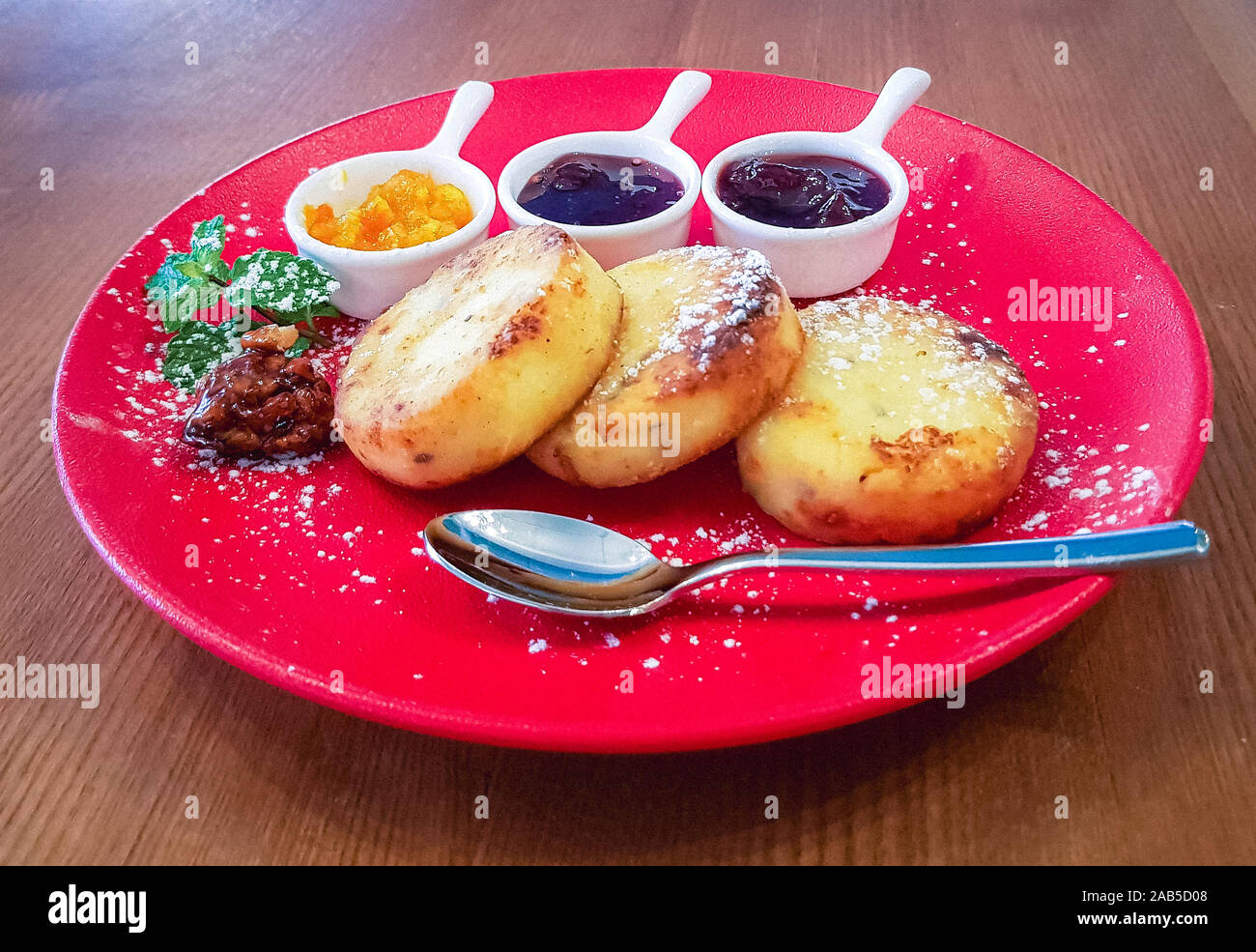 Cottage Cheese Pancakes With Almond Flour On A Red Plate Served