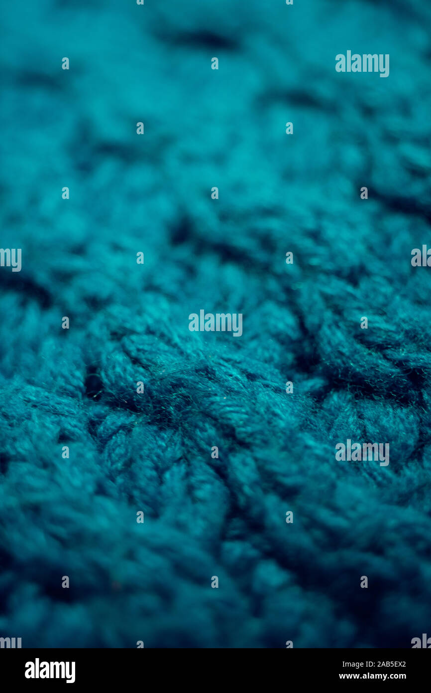 Knitted texture, blue thread pattern, cozy winter background. Stock Photo