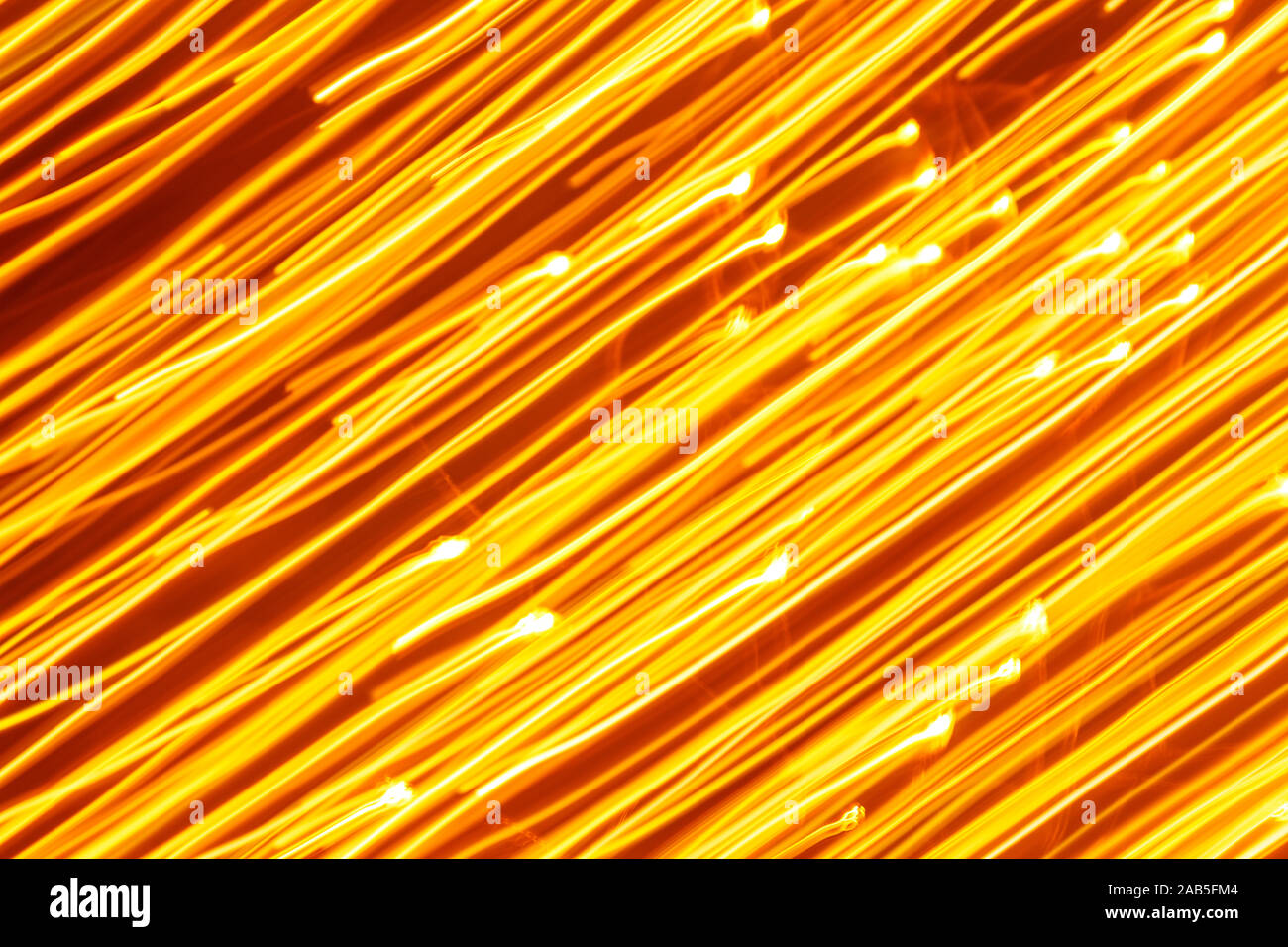 Futuristic blurred lights holiday monochrome background in yellow. Horizontal, soft focus Stock Photo
