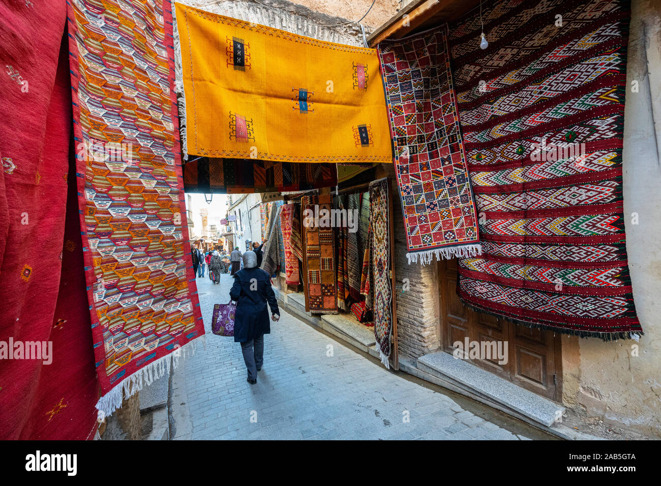 Fes, Morocco. November 9, 2019. Carpet sellers on the streets of the medina Stock Photo