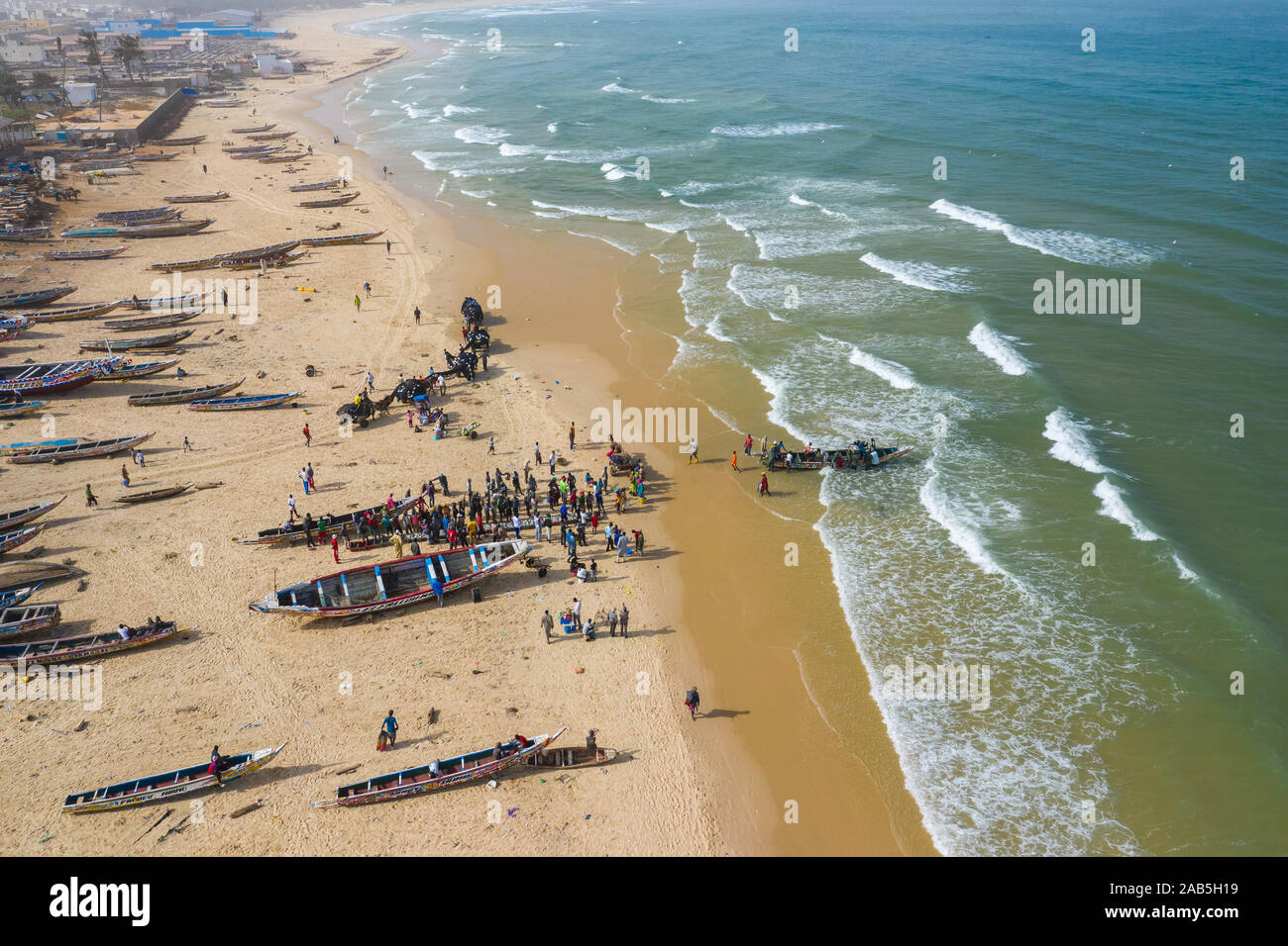 Aerial view of fishing village, pirogues fishing boats in Kayar, Senegal.  Photo made by drone from above. Africa Landscapes. - Stock Image