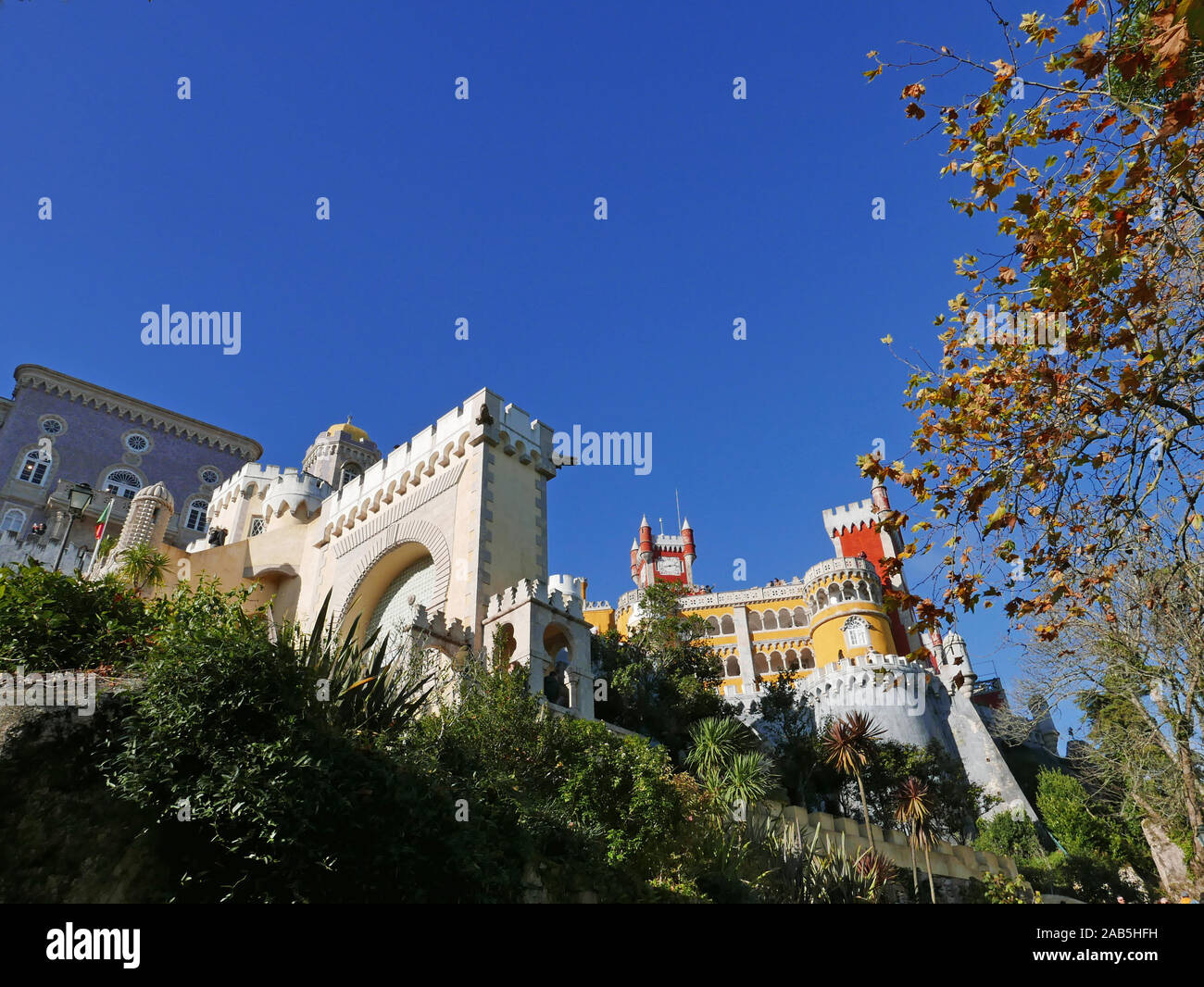 Looking upward toward one side of the castle at Sintra near Lisbon in Portugal known as the Pena Palace in São Pedro de Penaferrim Stock Photo