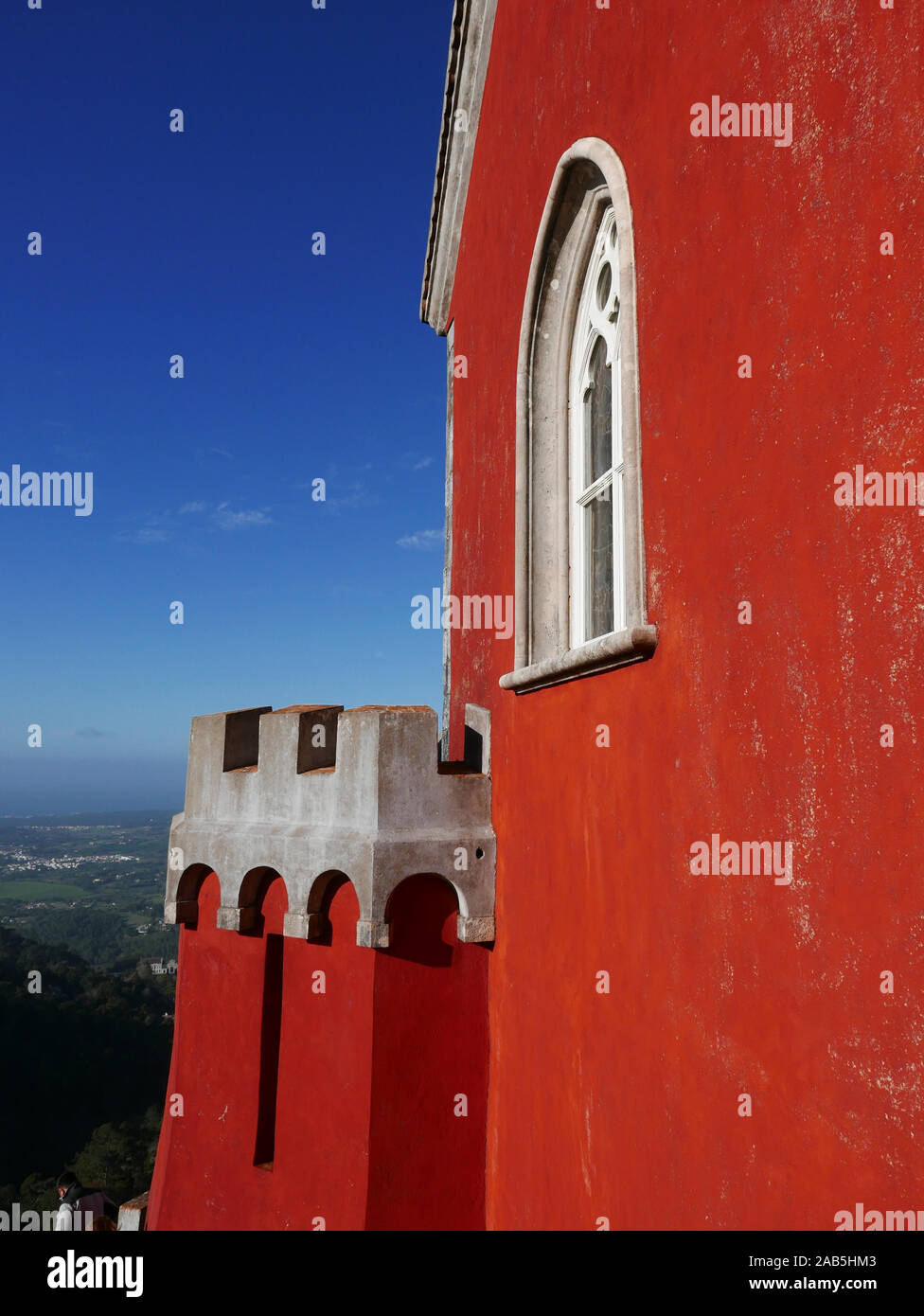 The red painted wall of one side of the castle at Sintra near Lisbon in Portugal known as the Pena Palace in São Pedro de Penaferrim Stock Photo