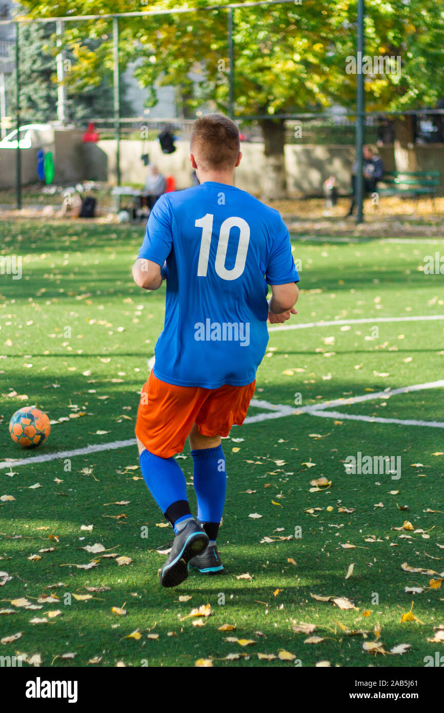 One soccer player performs an action play on a soccer field. All