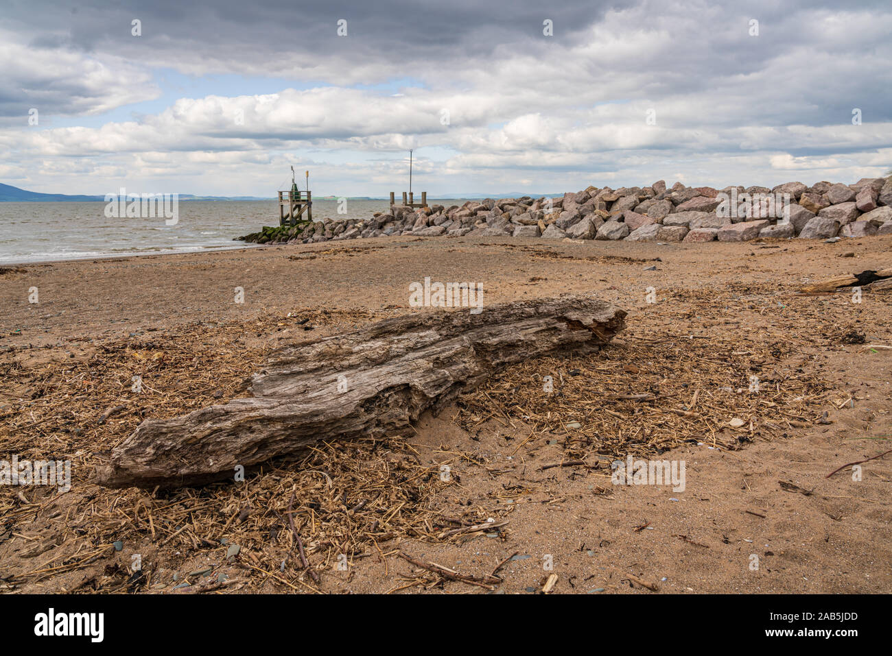 Driftwood on the West Beach in Silloth, Cumbria, England, UK Stock