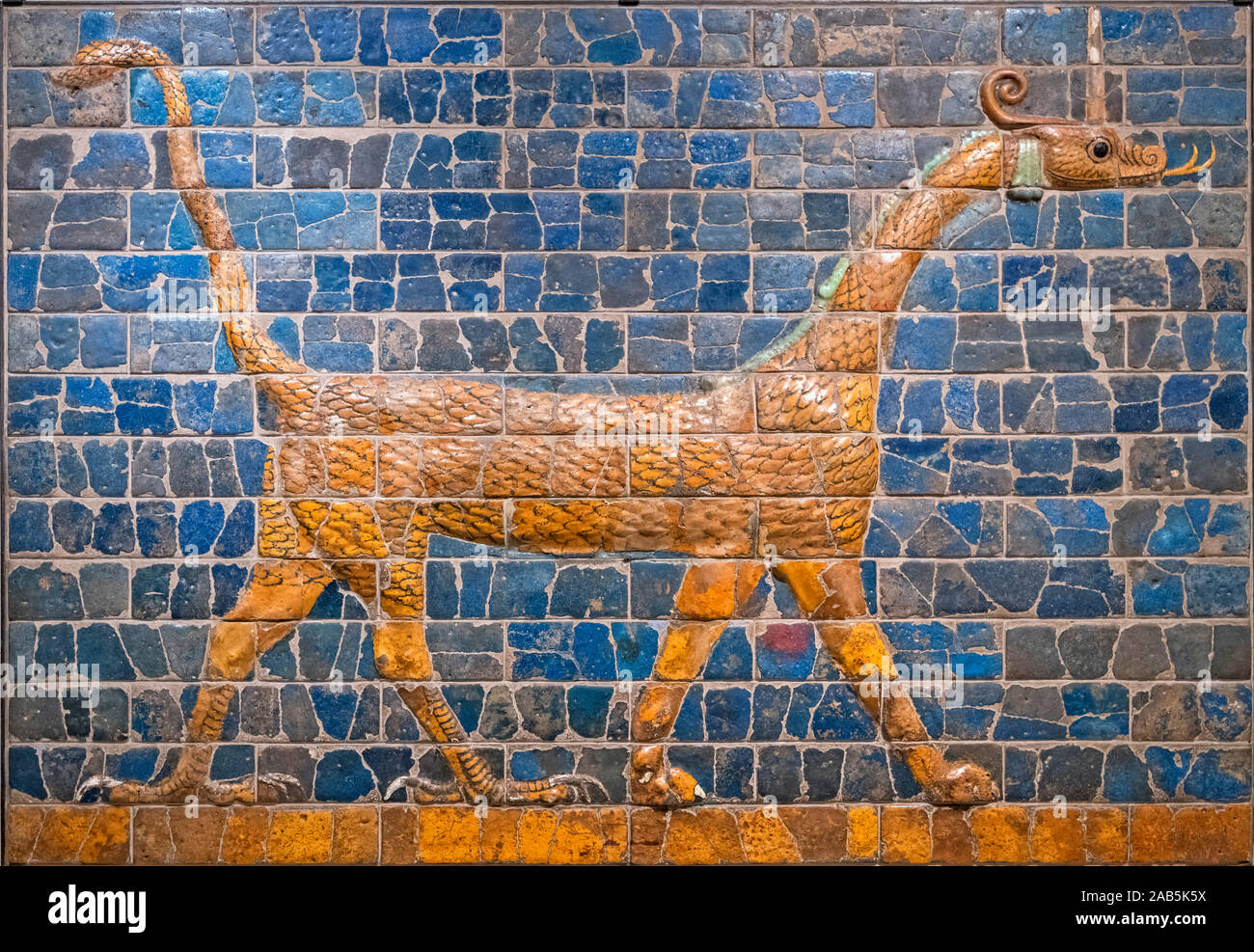 Babylonian Mushhushshu-dragon, Symbol of the God Marduk, 604 - 562 BC, glazed terracotta and molded brick. The striding dragon was a portion of the decoration of the Ishtar Gate in the ancient city of Babylon. Stock Photo
