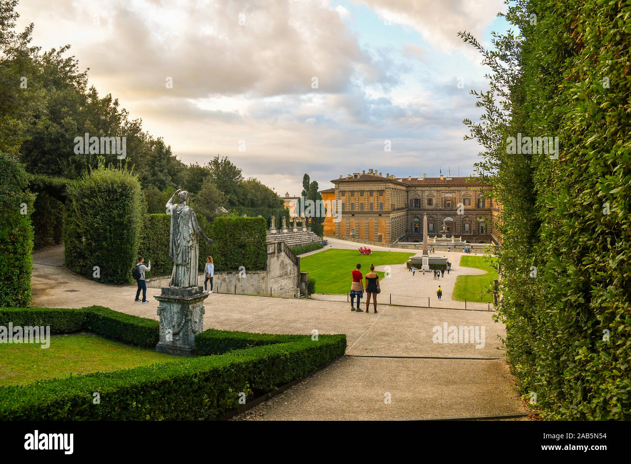 View of the Boboli Gardens of Palazzo Pitti in the historic centre of Florence, Unesco World Heritage Site, with tourists at sunset, Tuscany, Italy Stock Photo
