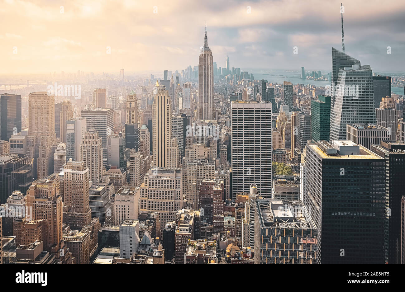 Iconic aerial view of New York City on a sunny day. Sunbeams between ...
