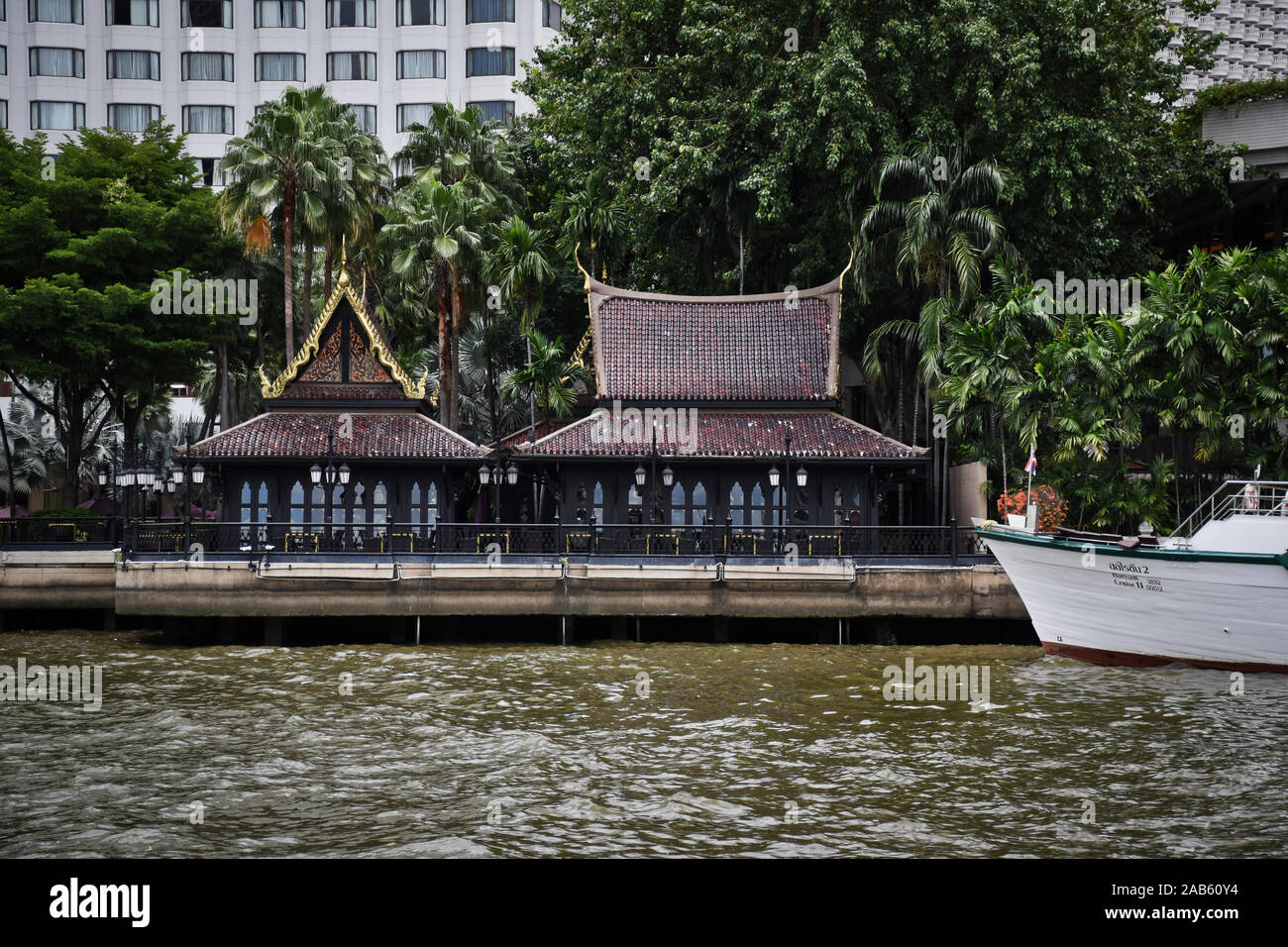 Bangkok, Thailand .11.24.2019: View of the private pier with traditional thai houses of the luxury and exclusive Shangri-La Hotel alongside the Chao P Stock Photo