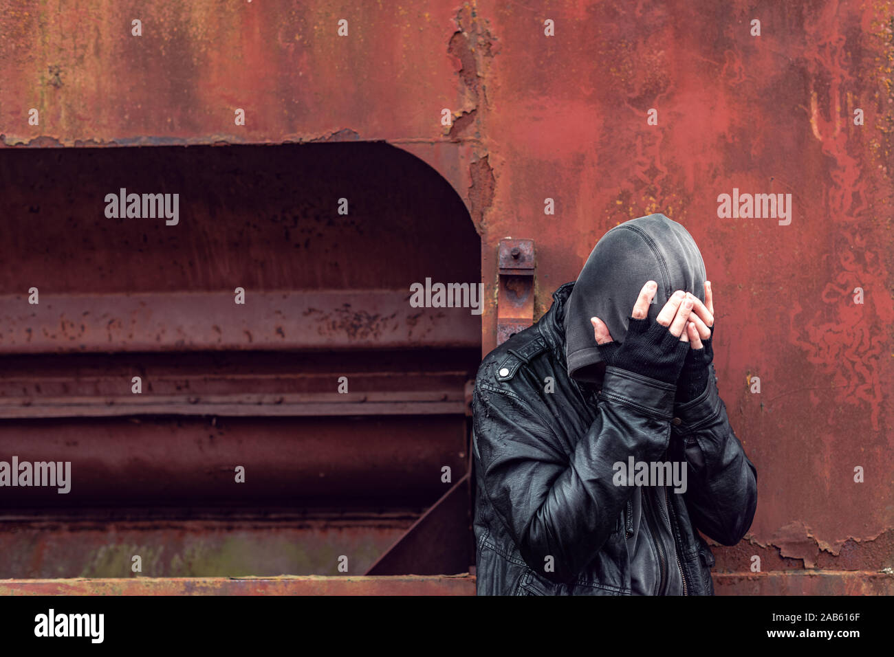 Homeless drug addict having abstinence crisis, conceptual portrait with selective focus Stock Photo