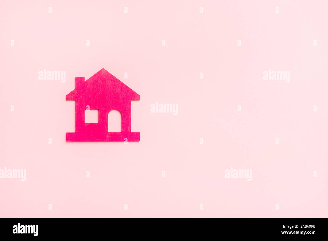 Pink house on pink background. New home concept Stock Photo Alamy