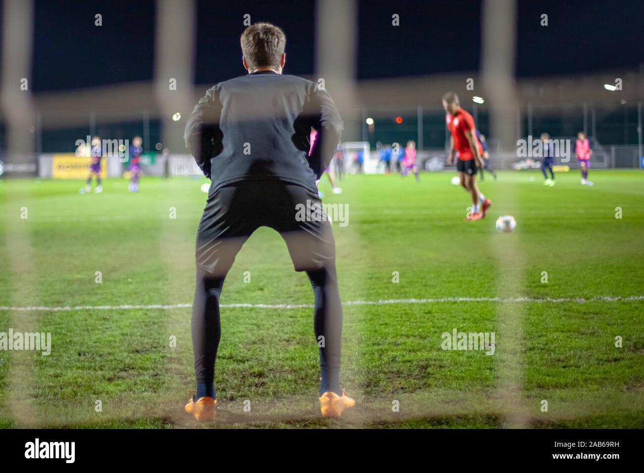 Goalkeeper catch the ball when defensive on goal during a football