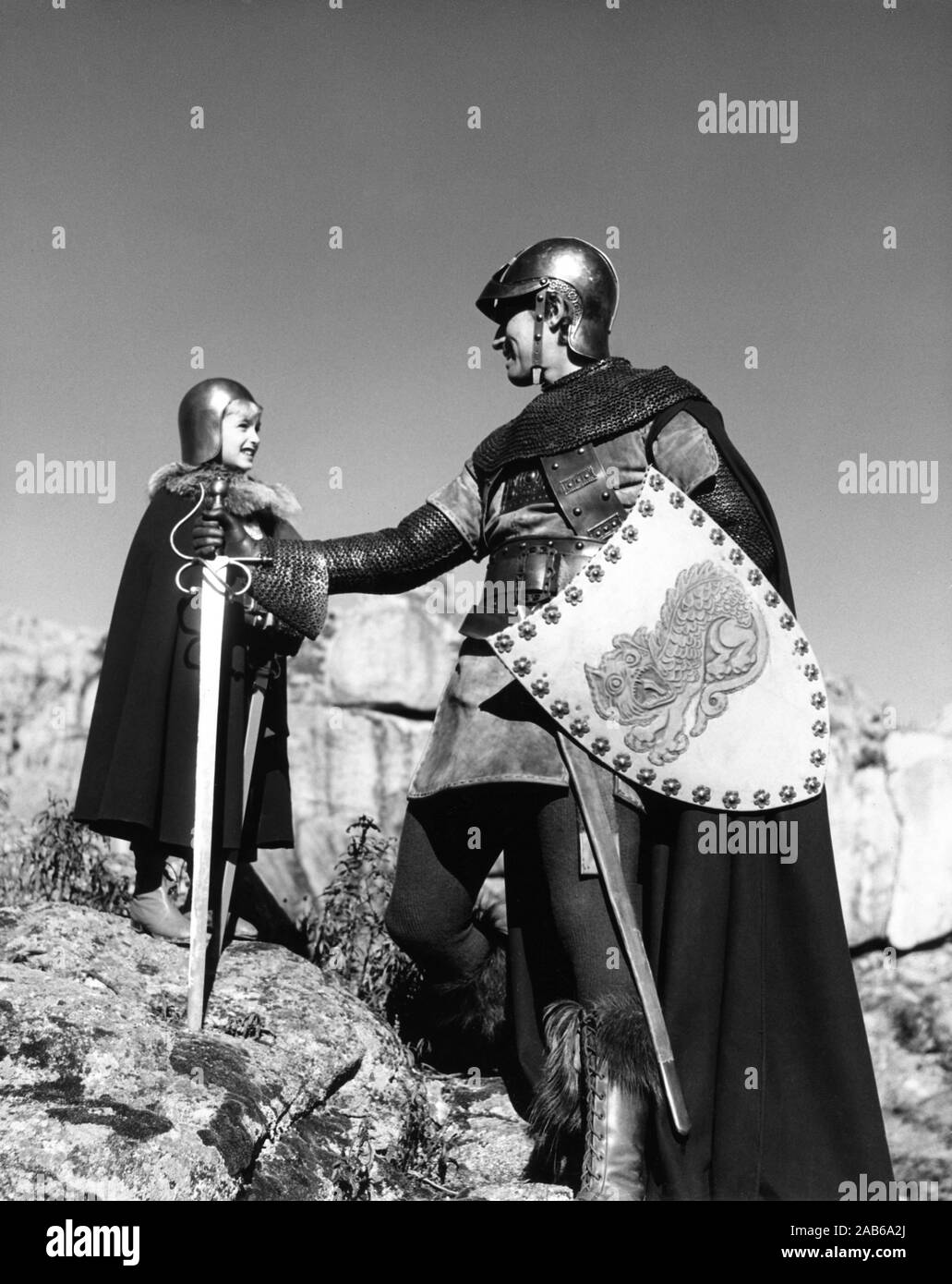 CHARLTON HESTON and his son FRASER HESTON in matching armour on set candid during location filming for EL CID 1961 director ANTHONY MANN music Miklos Rozsa  Italy / USA co-production Samuel Bronston Productions / Dear Film Produzione Stock Photo