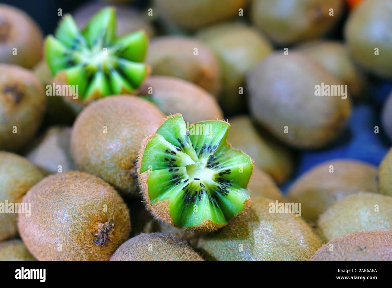 Kiwi fruit cut in half with zigzag edges Stock Photo Alamy