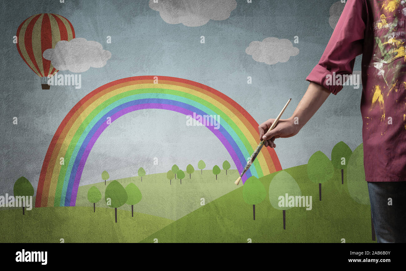 Close up artist hand holding paintbrush Stock Photo - Alamy