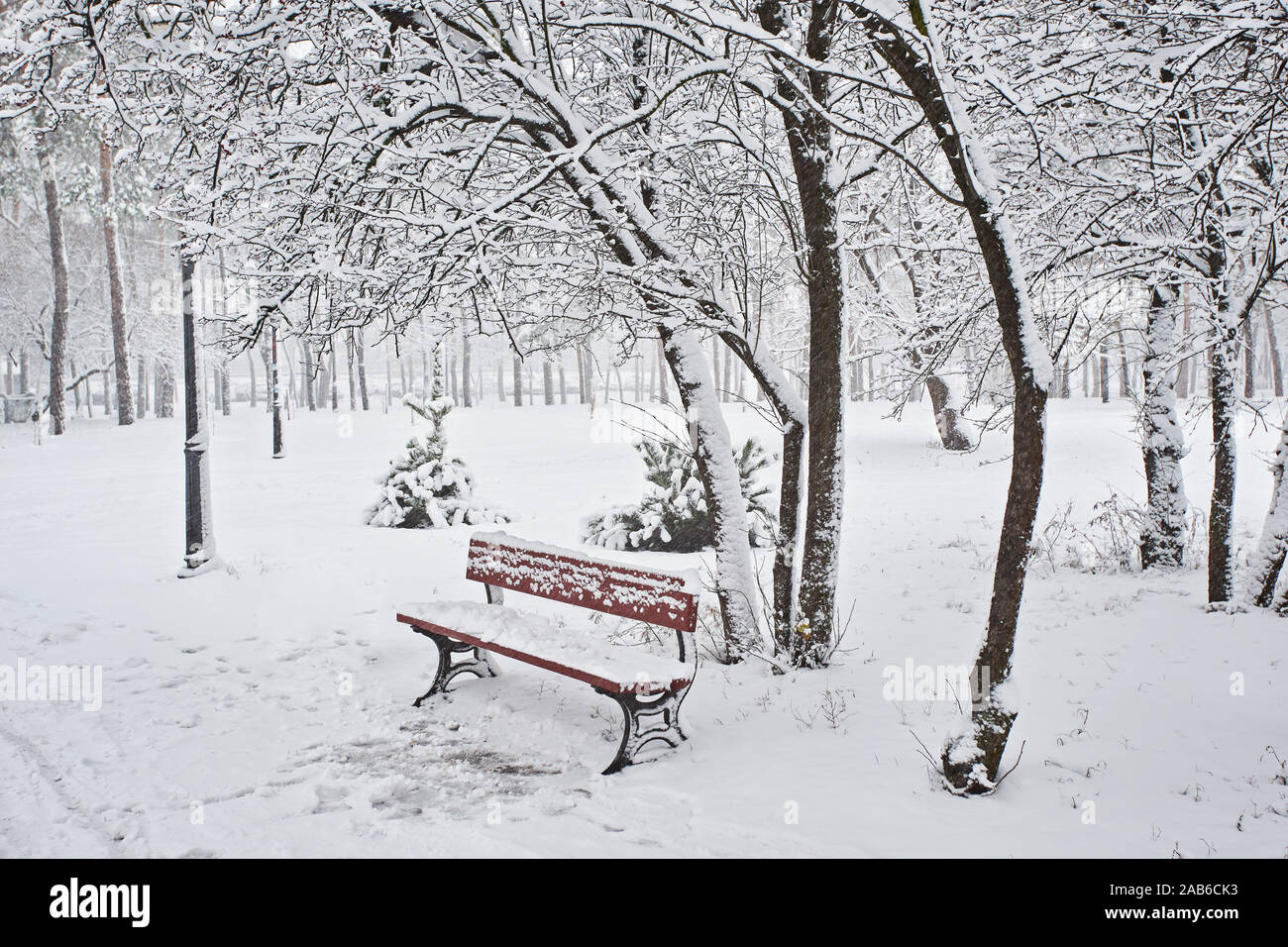 Benches in the winter city park. Filled up with snow. Snow covered ...