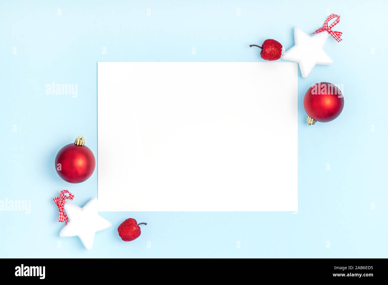 New Year and Christmas frame composition. Blank sheet of paper on pastel  blue background. Top view, flat lay, copy space. Template design invitation  card Stock Photo - Alamy