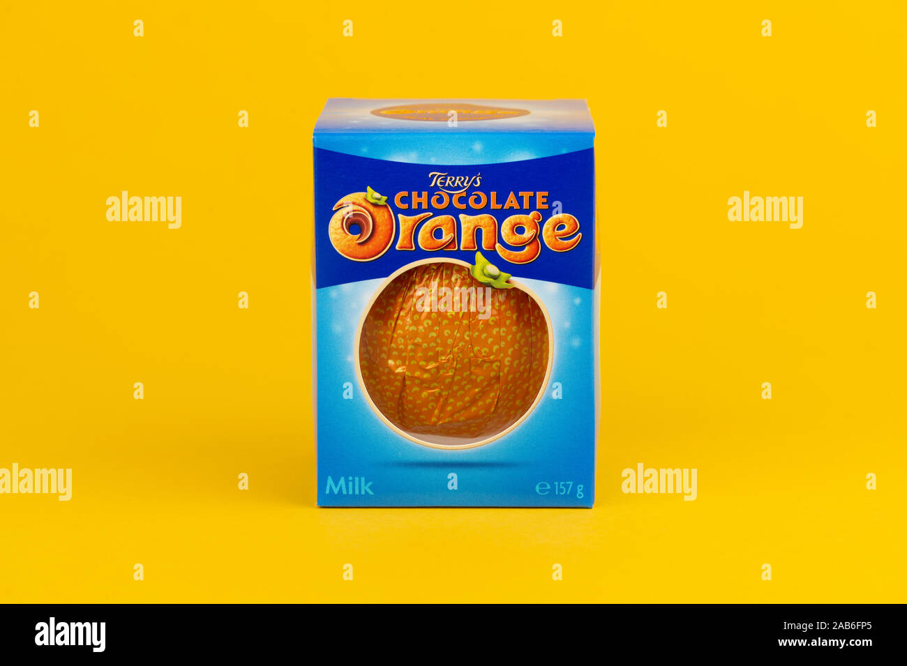 A Terry's Chocolate Orange shot on a yellow background. Stock Photo