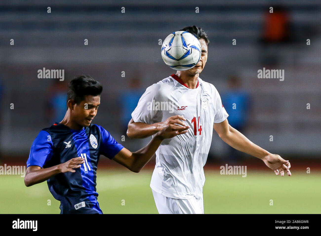 Manila, Philippines. 25th Nov, 2019. Javier Augustine Gayoso (R) of the Philippines competes with Sin Kakada of Cambodia during the men's first round football match at the SEA Games 2019 in Manila, the Philippines, Nov. 25, 2019. Credit: Rouelle Umali/Xinhua/Alamy Live News Stock Photo
