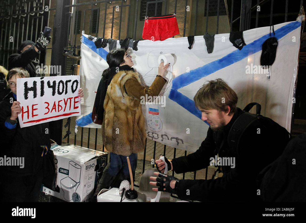 An activists take part in a performance called the Humanitarian Aid for Russians during the protest outside the Embassy of Russia in Kiev.As media reported, three Ukrainian naval vessels Berdiansk, Nikopol and Yany Kapu, seized by Russia almost a year ago and were returned to the Ukrainian port of Ochakiv on 20 November 2019 in poor condition, with dismantled weapons, communications and navigation equipment and without some parts of equipment and including ceiling lights, sockets and toilet bowls. Ukrainian ships which were seized by the Russian Federation a year ago, arrived at the Ukrainian Stock Photo