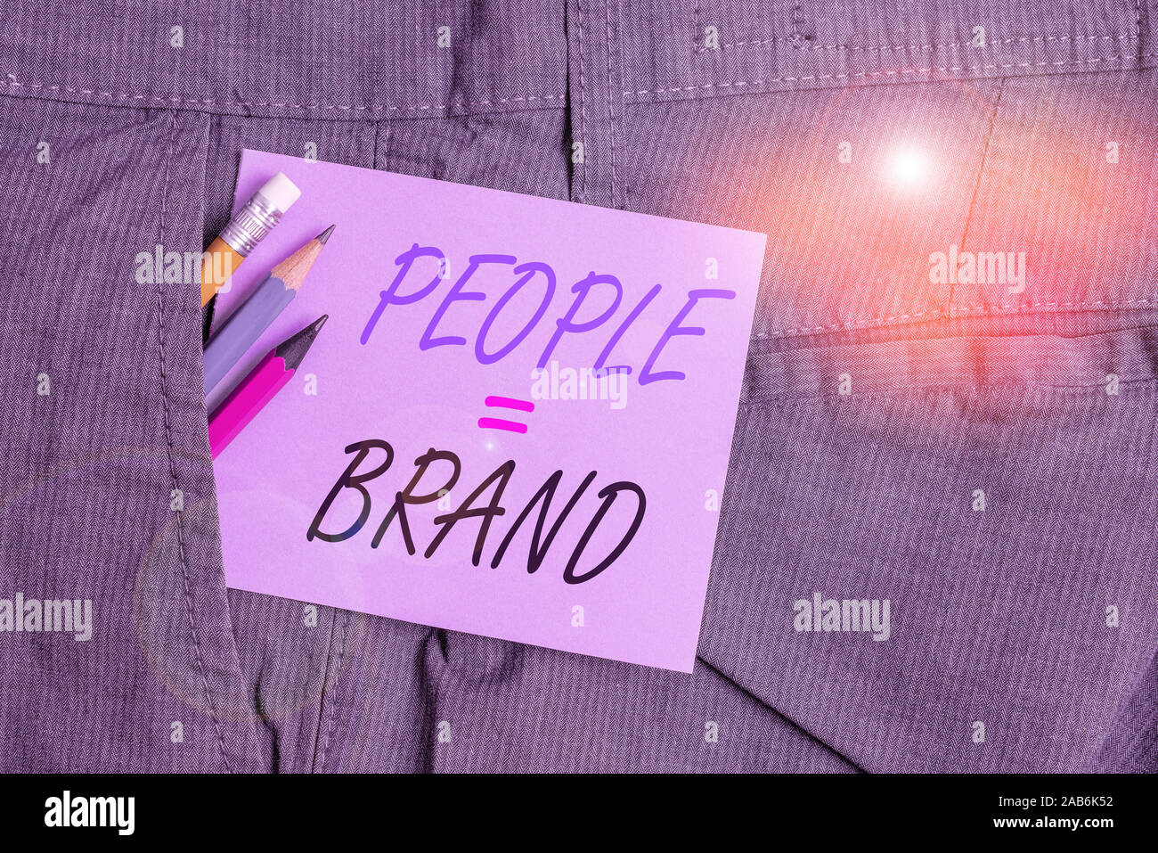 Writing note showing People Brand. Business concept for Personal Branding Defining demonstratingality through the labels Writing equipment and purple Stock Photo