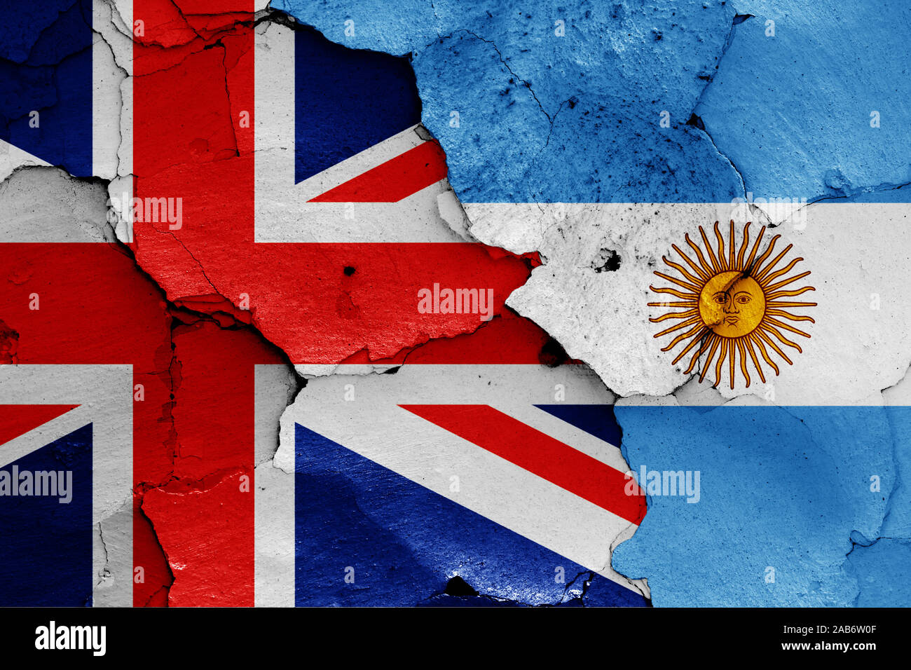 flags of UK and Argentina painted on cracked wall Stock Photo