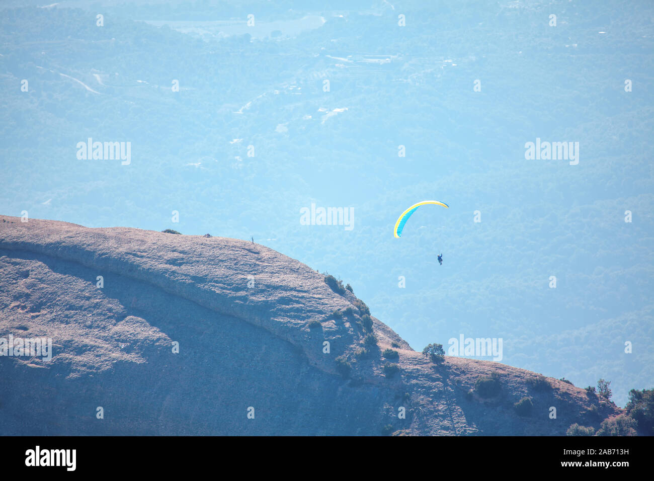 extreme sport , paraglider flight over the mountains Stock Photo