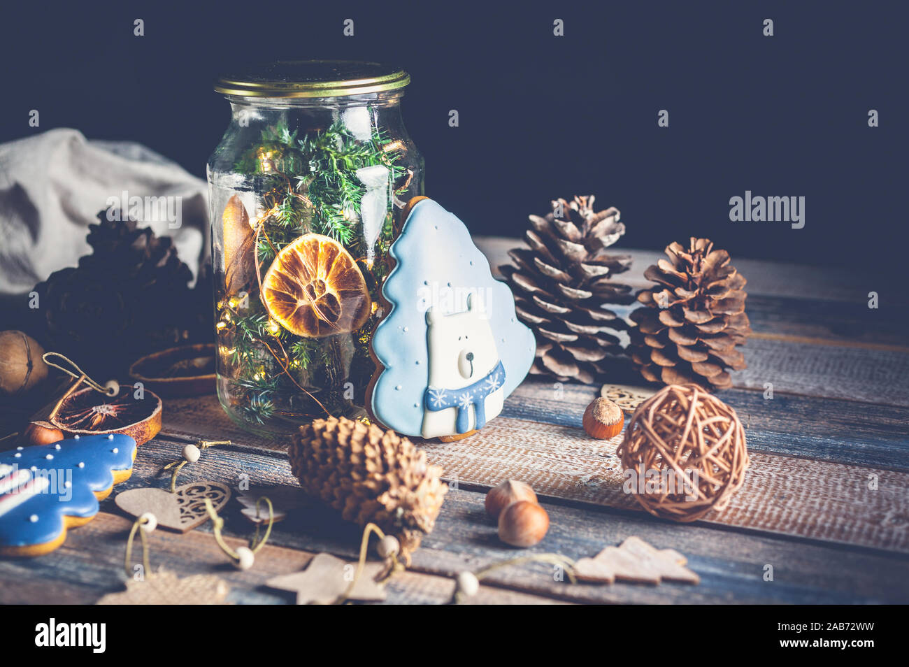 Christmas gingerbread, tree traditional toys on a wooden background. Low key lighting composition. Stock Photo