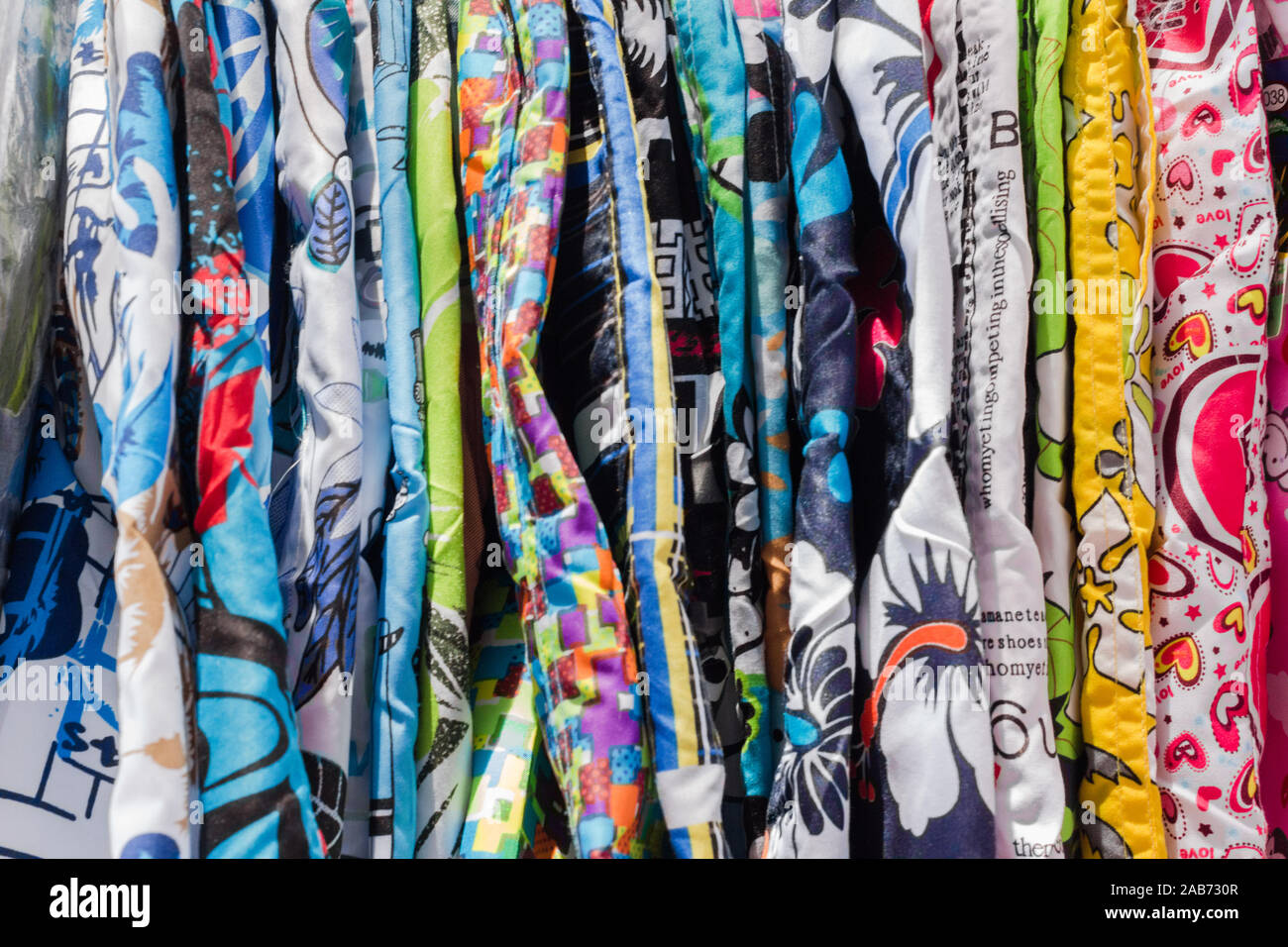 Hong Kong - November 2019: Colorful clothes lineup in flea market. Stock Photo