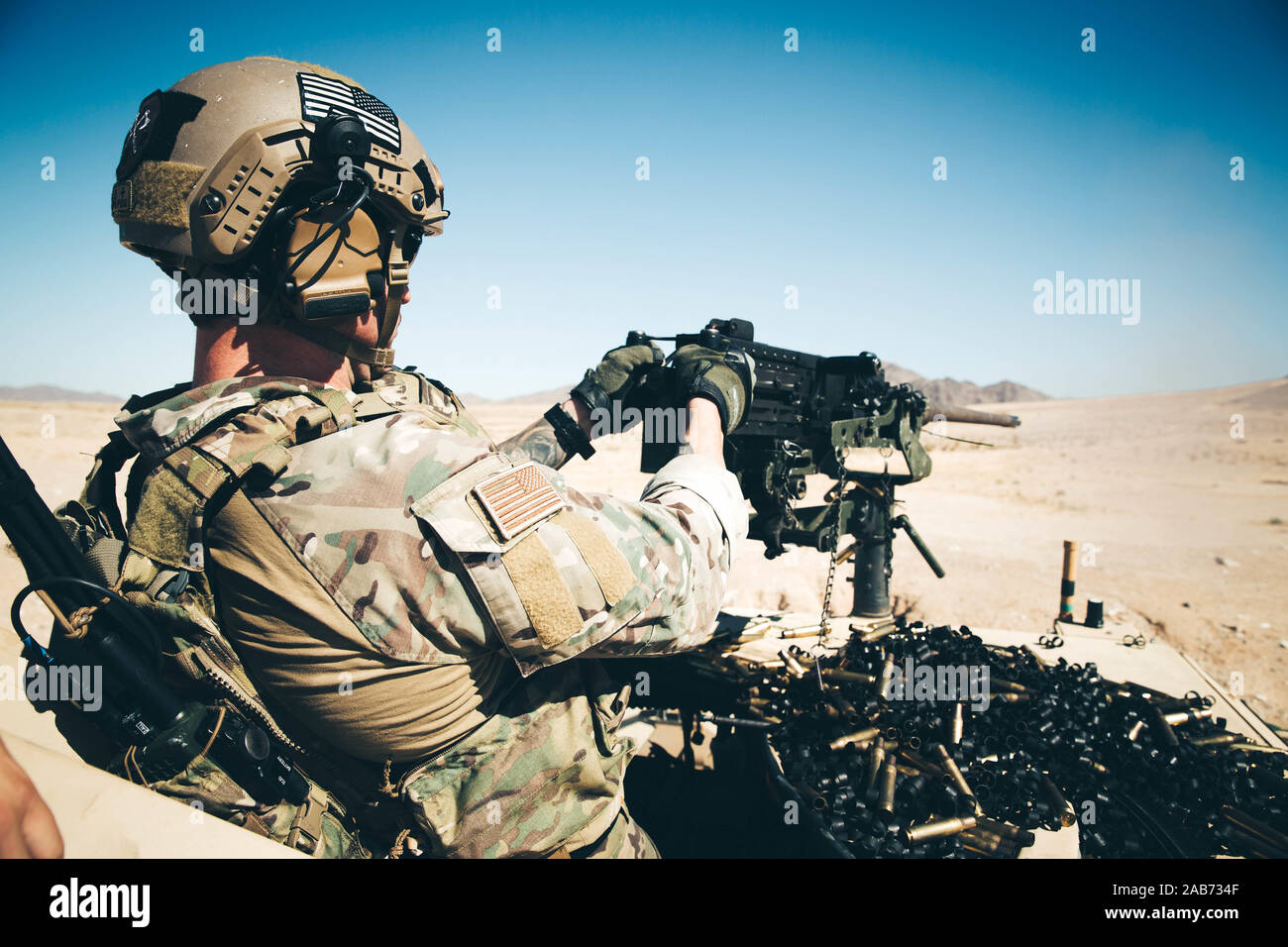 A U.S. Army Special Operations Soldier with 3rd Special Forces Group (Airborne) fires a Browning M2 .50 cal machine gun during at Marine Corps Air Ground Combat Center (MCAGCC), Twentynine Palms, Calif., Oct. 15, 2019. The Green Berets used the MCAGCC training areas to refine detachment tactics and prepare for combat operations. (U.S. Marine Corps photo by Cpl. William Chockey) Stock Photo