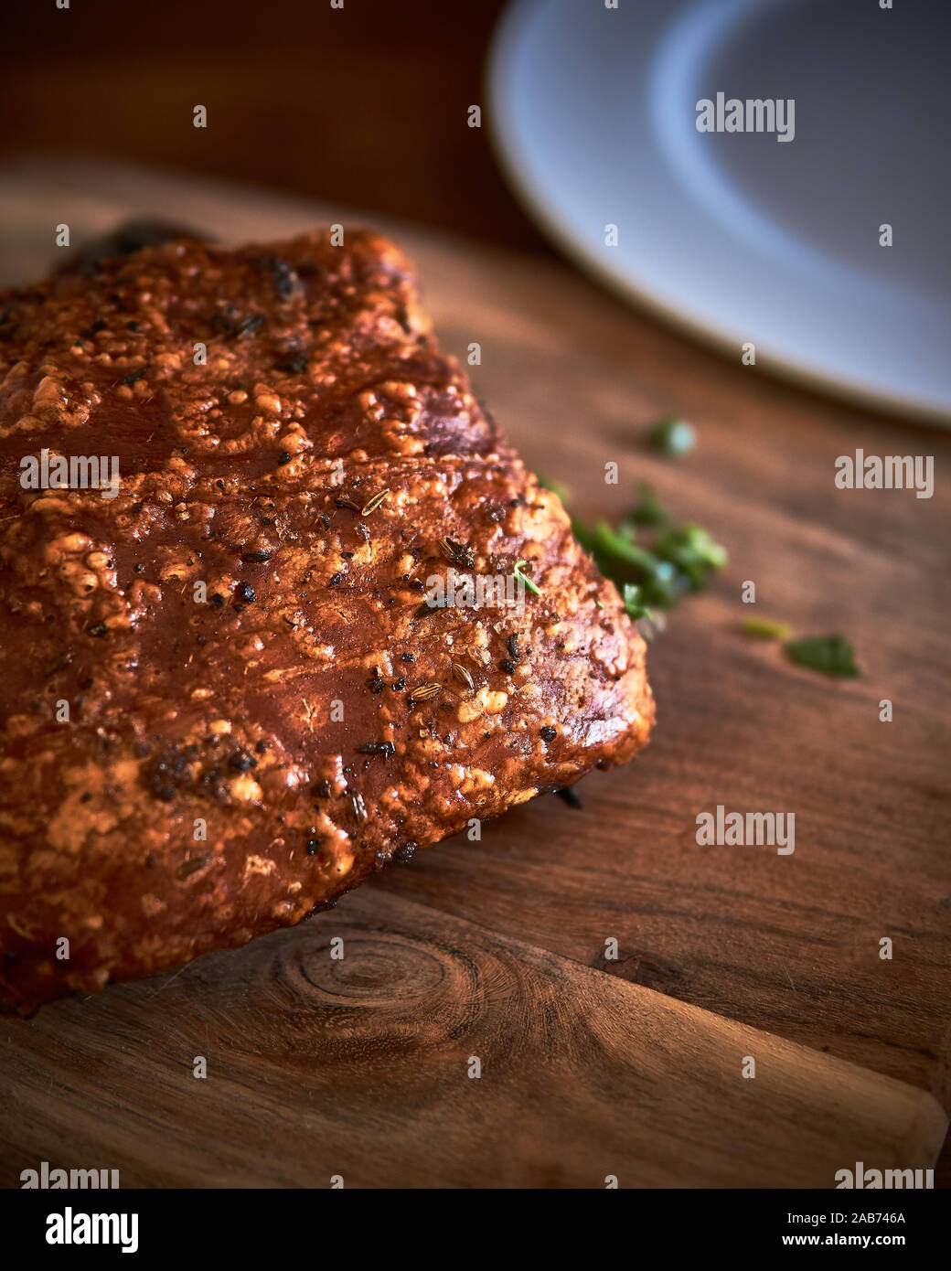 Yummy roasted pork belly with tasty crunchy crackling and parsley. Stock Photo