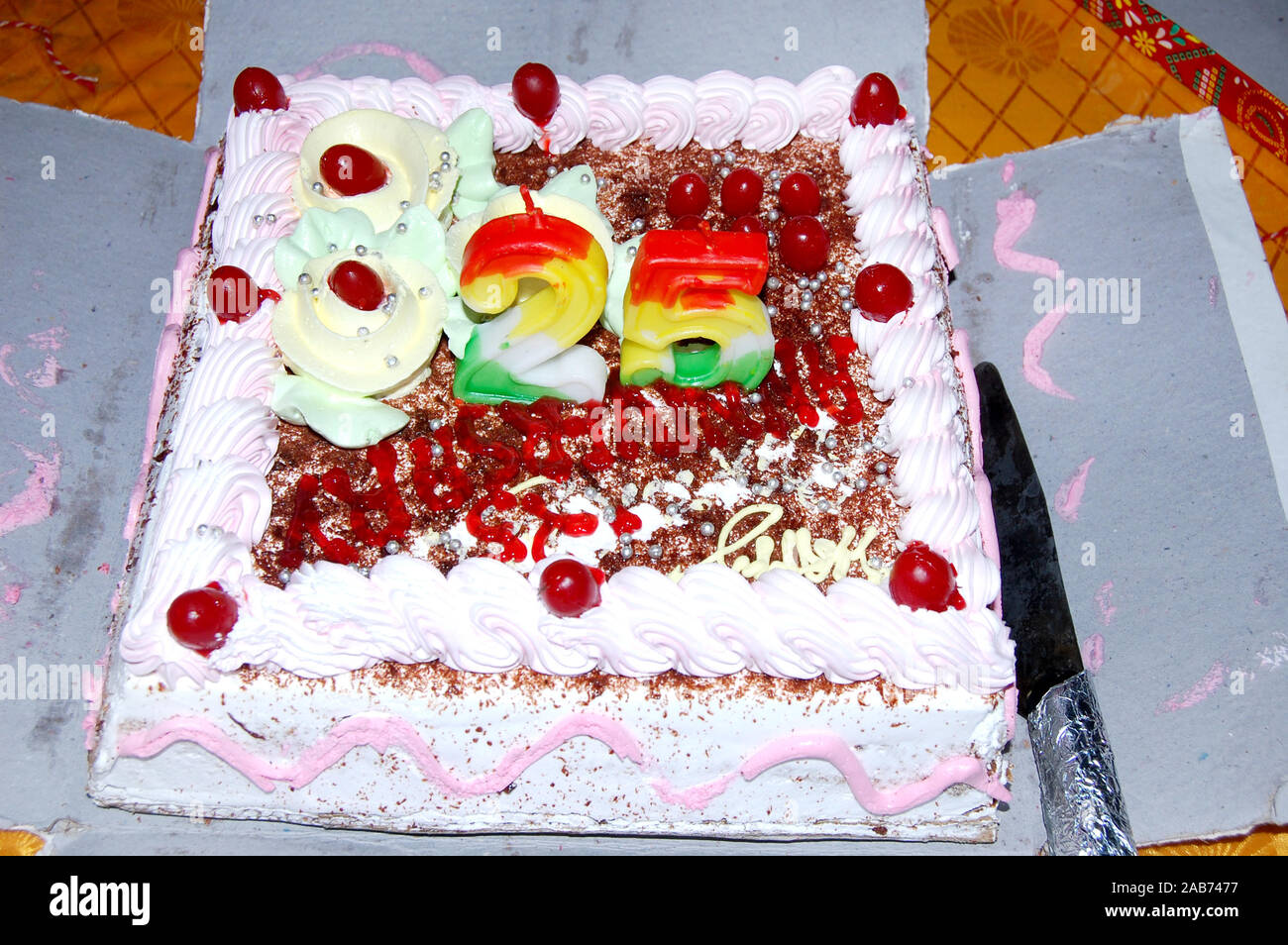 Birthday cake with colorful candles Stock Photo - Alamy