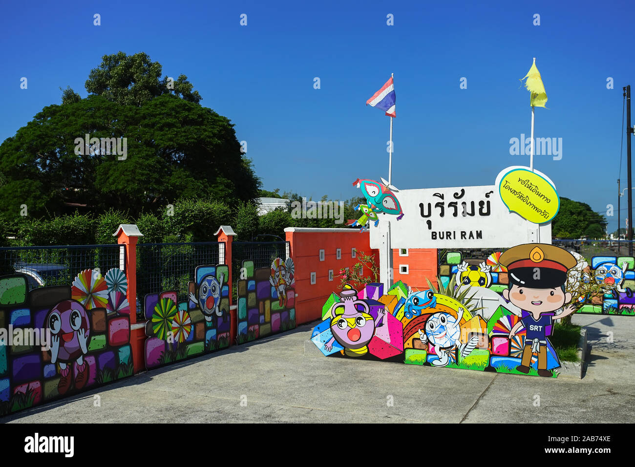 Colorful board for travel promoted in Buri Ram train station, Thailand. (Translation:Buri Ram and Bon Voyage in yellow textbox) Stock Photo