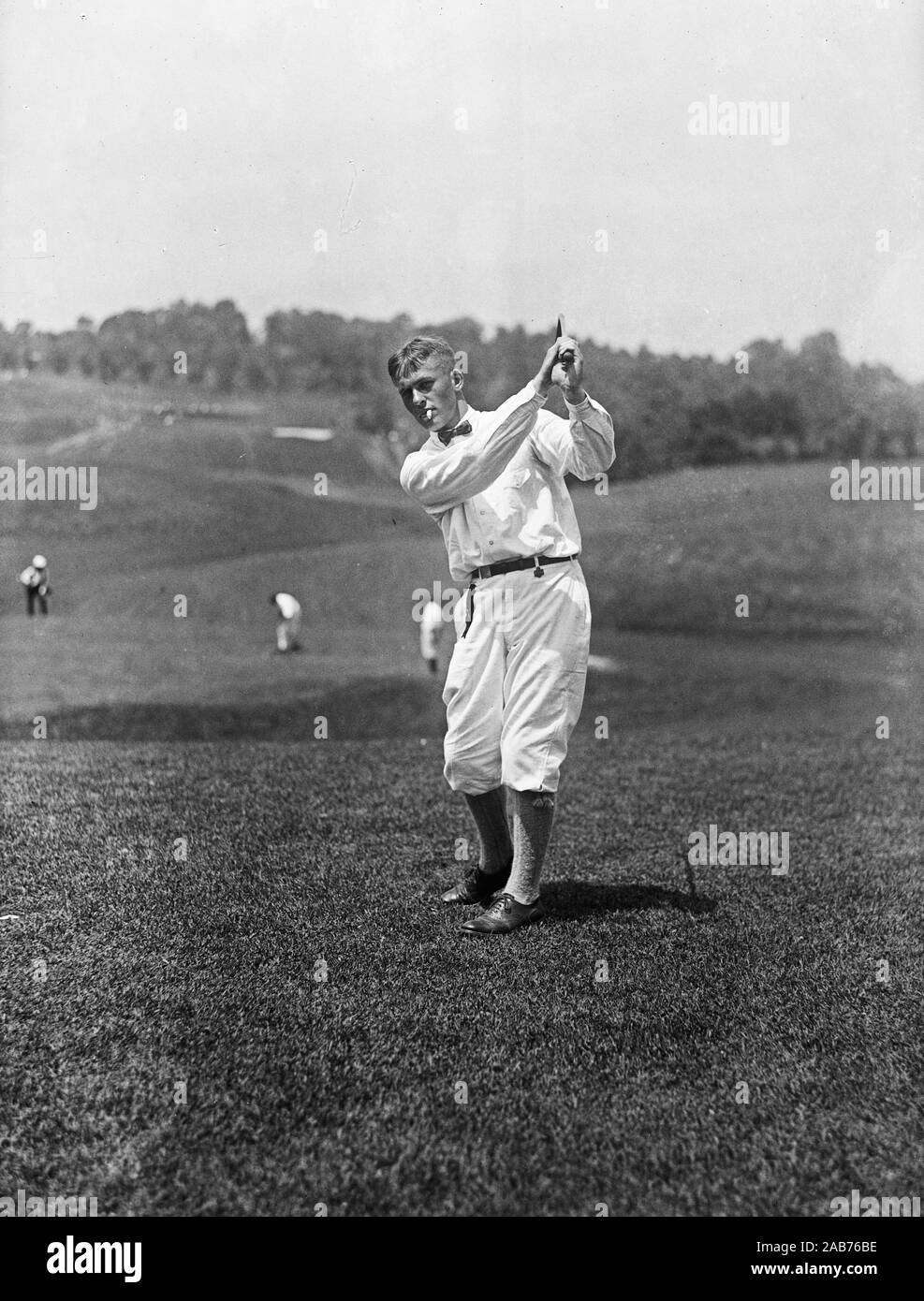 Vintage golf photo golfer swinging a golf club ca. 19211923 Stock