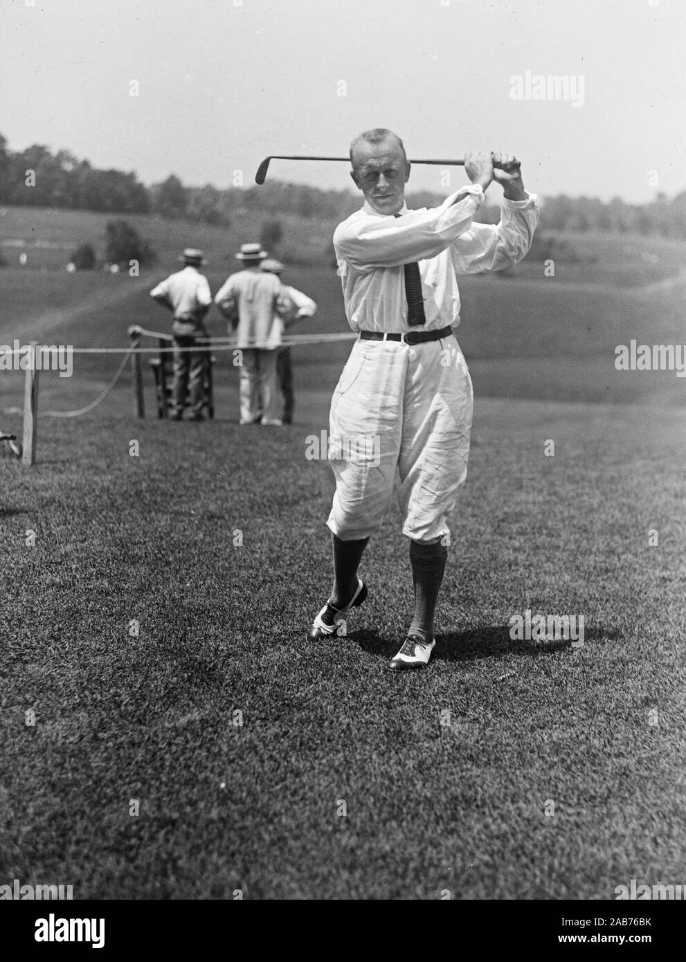 Vintage golf photo - golfer swinging a golf club ca. 1921-1923 Stock Photo