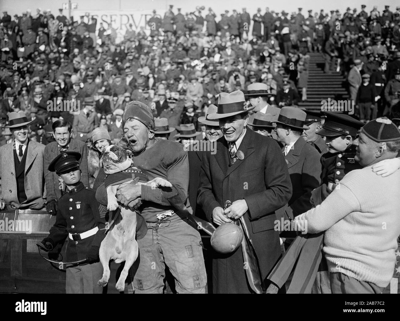Georgetown football player holds their mascot ca. Novemer 1927 Stock Photo