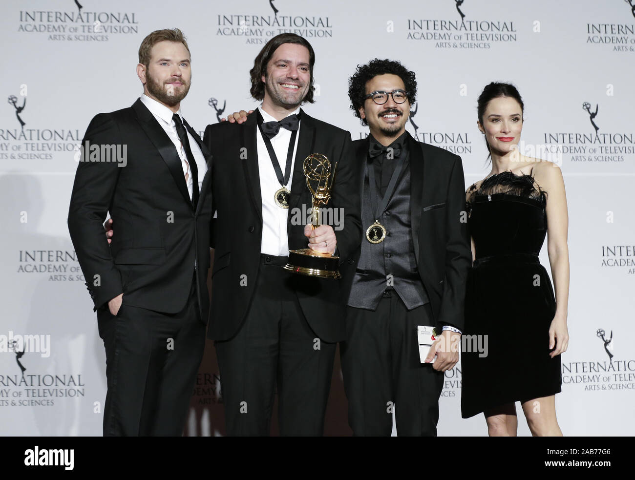 New York, United States. 25th Nov, 2019. US actor Kellan Lutz, Brazilian director Wladimir Winter Nobrega de Almeida, producer Leonardo Martin Neumann Pereira and US actress Abigail Spencer stand in the press room with the award for 'Short-Form Series' for 'Hack the City' at the 47th International Emmy Awards at the New York Hilton in New York City on November 25, 2019. Photo by John Angelillo/UPI Credit: UPI/Alamy Live News Stock Photo