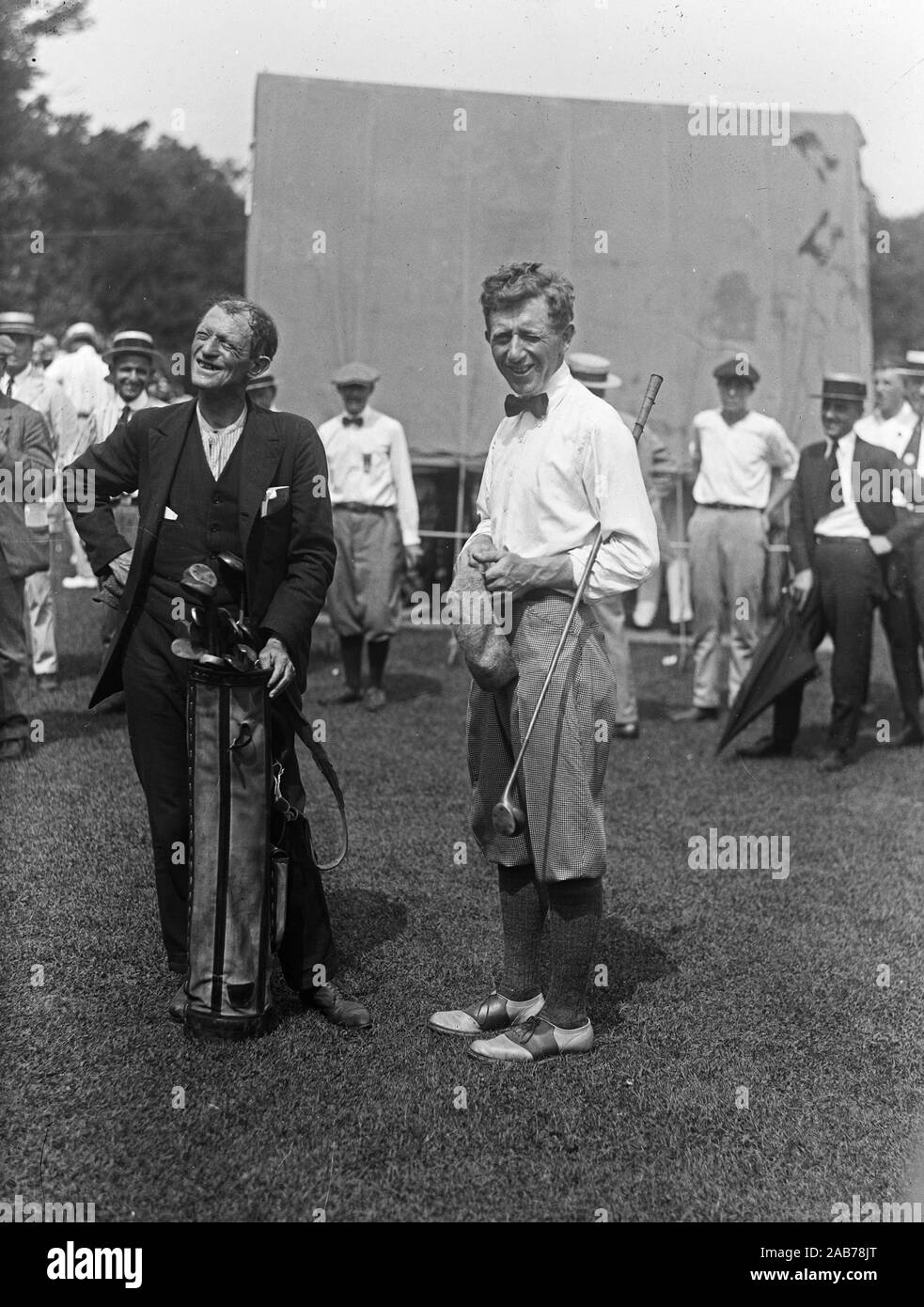 Vintage golf photo - A golfer and his caddie at a golf tournament ca. 1921-1923 Stock Photo