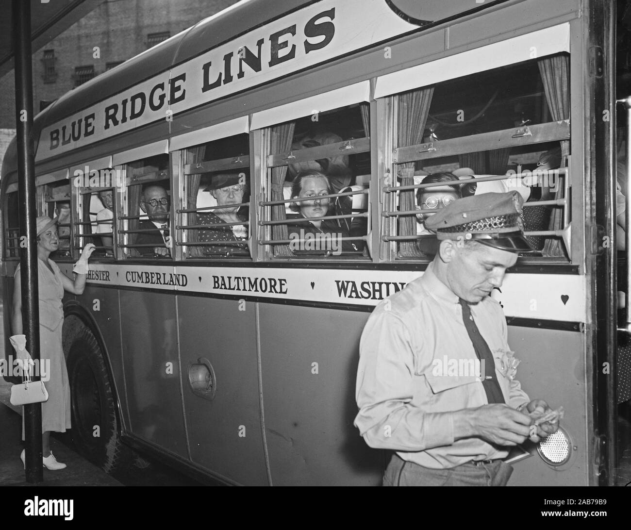 Bus driver and passengers of a Blue Ridge Lines bus ca. 1936-1937 Stock ...