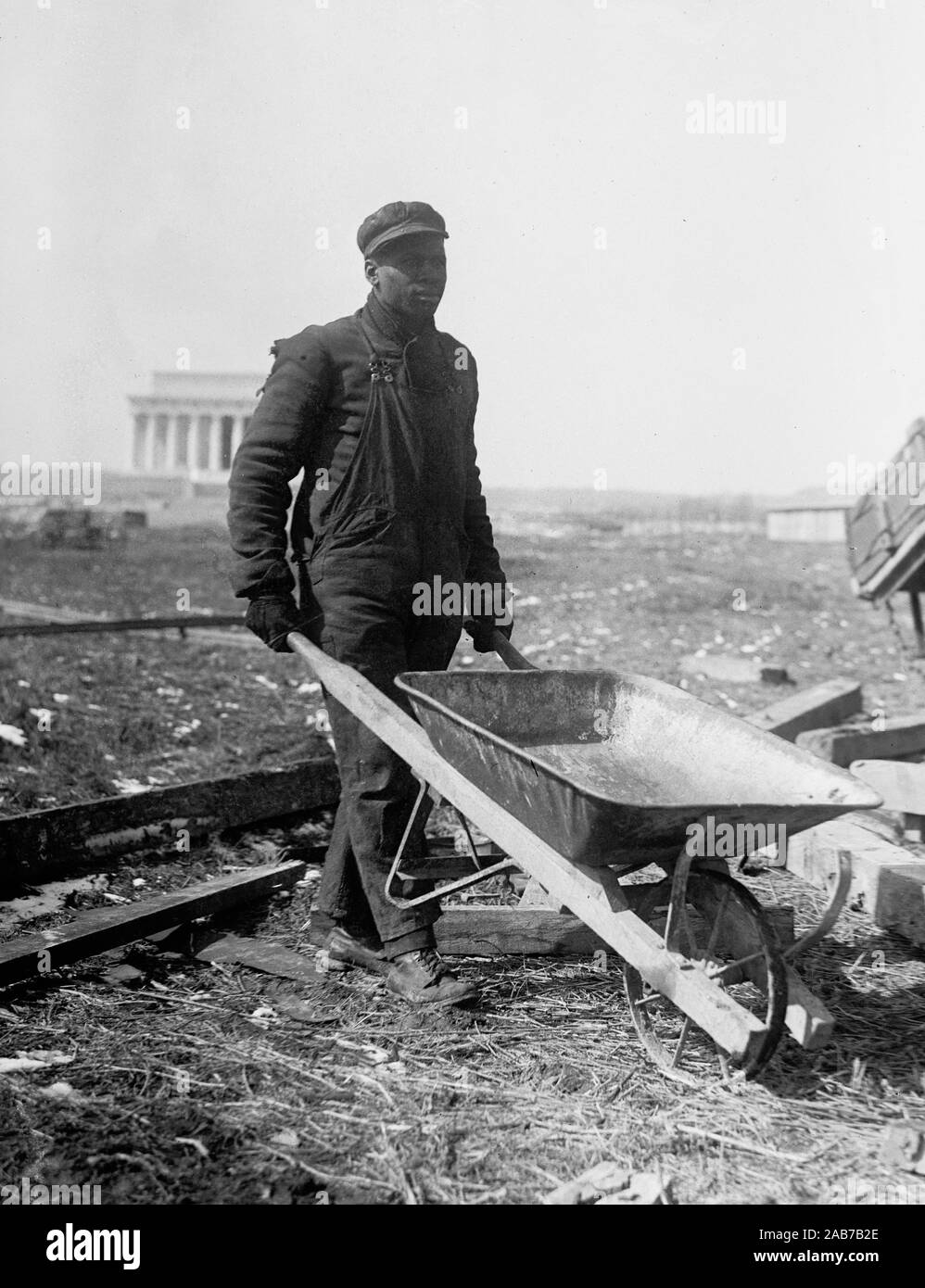 African American man doing manual labor at the construction of the
