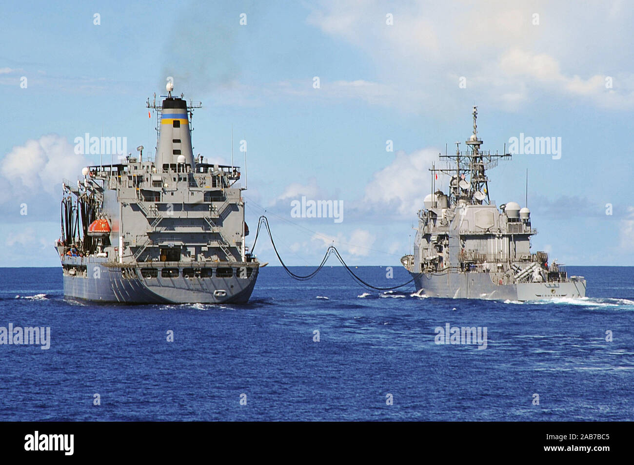 PACIFIC OCEAN (Sept. 5, 2012) The Military Sealift Command fleet replenishment oiler USNS John Ericsson (T-AO-194) and the Ticonderoga-class guided-missile cruiser USS Cowpens (CG 63) conduct a replenishment at sea while transiting in the U.S. 7th Fleet area of operations. Cowpens is part of the George Washington Carrier Strike Group, the Navy's only forward-deployed carrier strike group, and is conducting a routine western Pacific patrol. (U.S. Navy photo by Mass Communication Specialist Seaman Declan Barnes/Released) Stock Photo