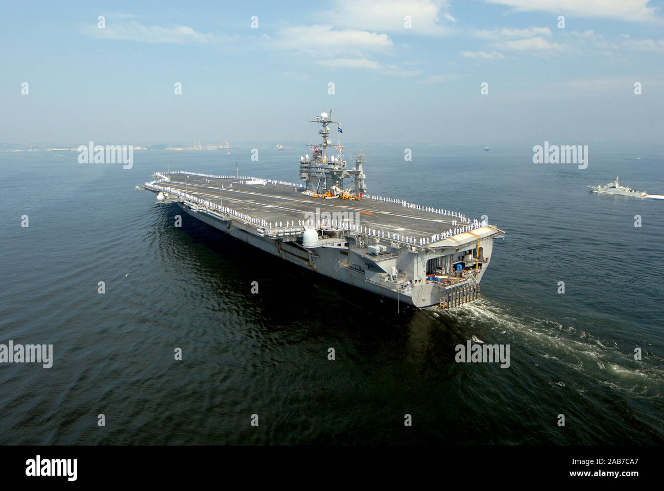 PACIFIC OCEAN (July 26, 2012) - The U.S. Navy's forward-deployed aircraft carrier USS George Washington (CVN 73) transits through Tokyo Bay as it returns to its forward-operating location of Yokosuka, Japan. The Nimitz-class aircraft carrier departed Fleet Activities Yokosuka on May 26 to begin its 2012 patrol. George Washington and its embarked air wing, Carrier Air Wing (CVW) 5, provide a combat-ready force that protects and defends the collective maritime interest of the U.S. and its allies and partners in the Asia-Pacific region. Stock Photo