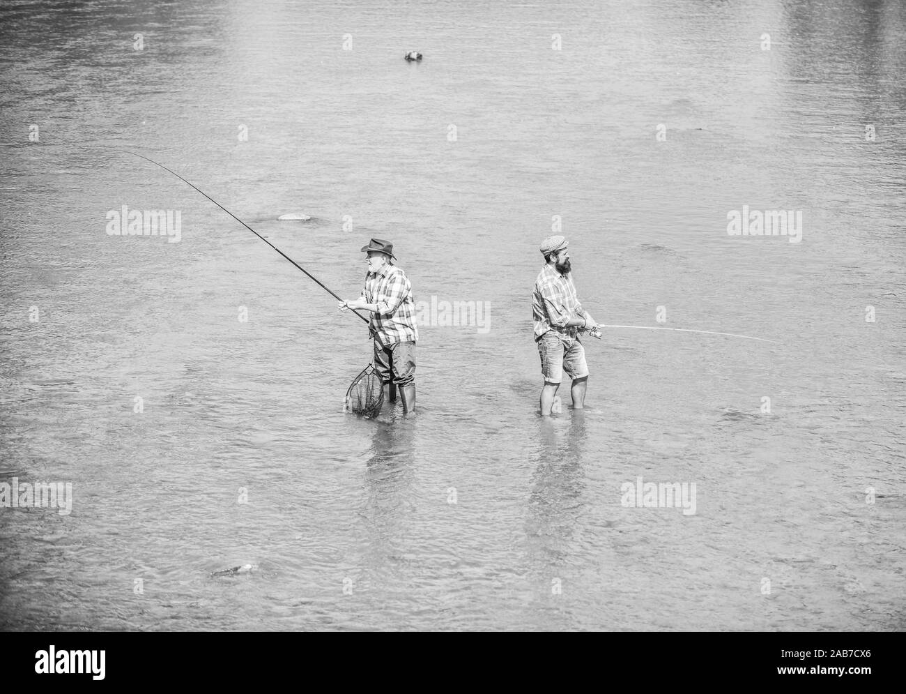 Fishing rod and fishing net Black and White Stock Photos & Images