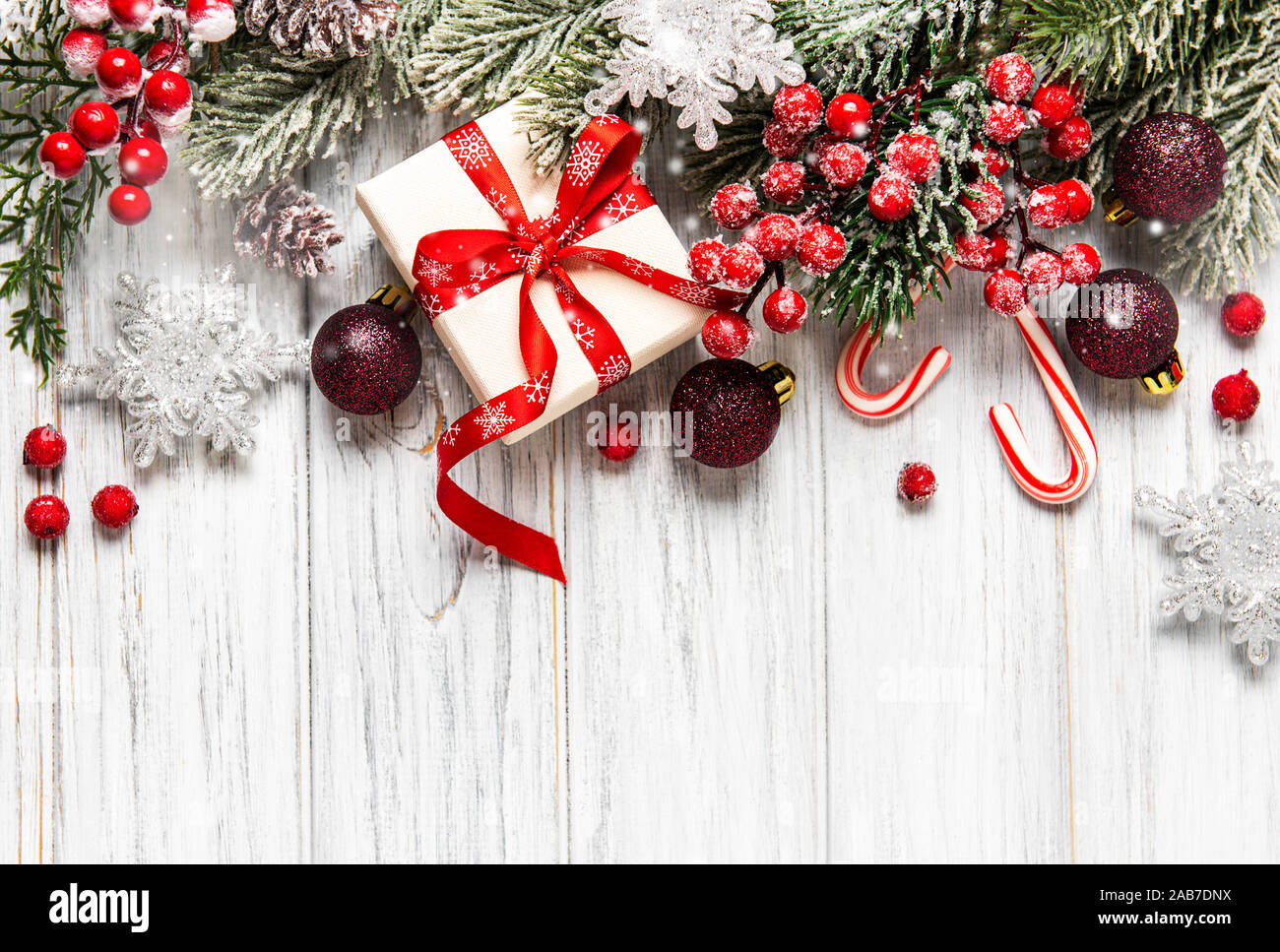 Christmas and New year background with fir branches, holly berry, pine ...