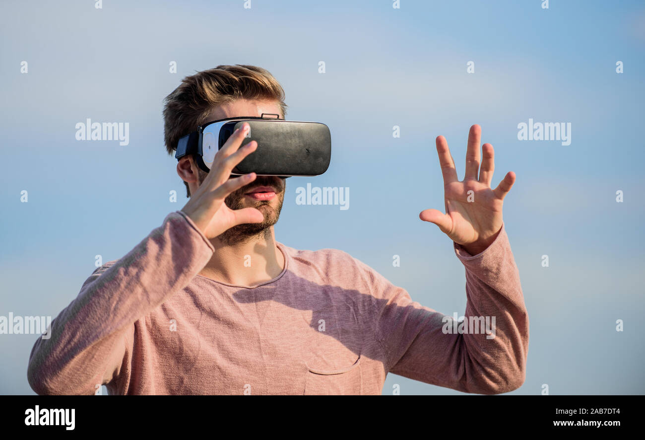 VR communication. Man explore VR sky background. VR technology and future.  Exciting impressions. Gaming and entertainment. Interaction with digital  surface. Gesture control. 3d visualization Stock Photo - Alamy