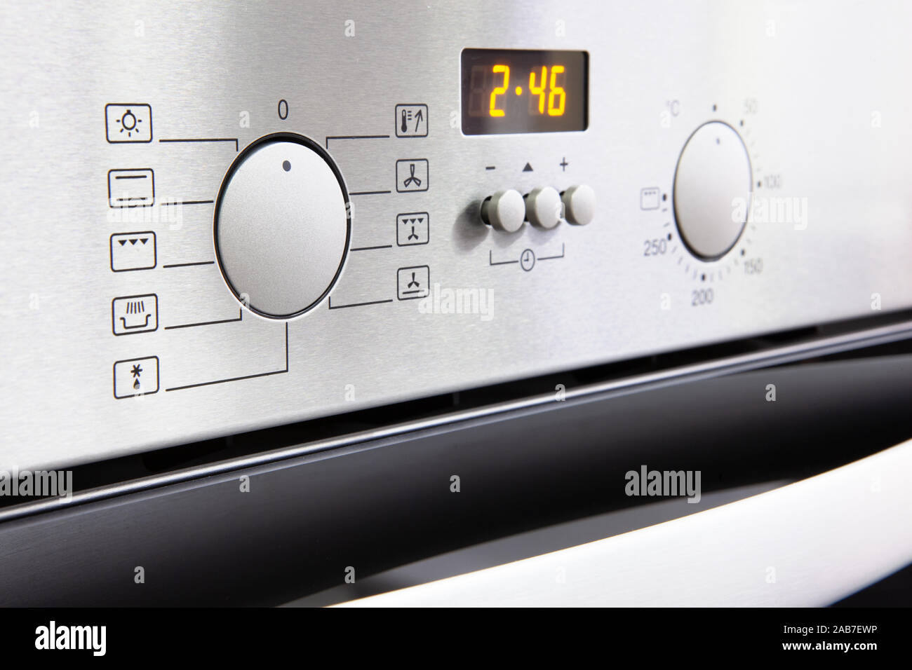 closeup of oven dashboard with grey buttons Stock Photo Alamy