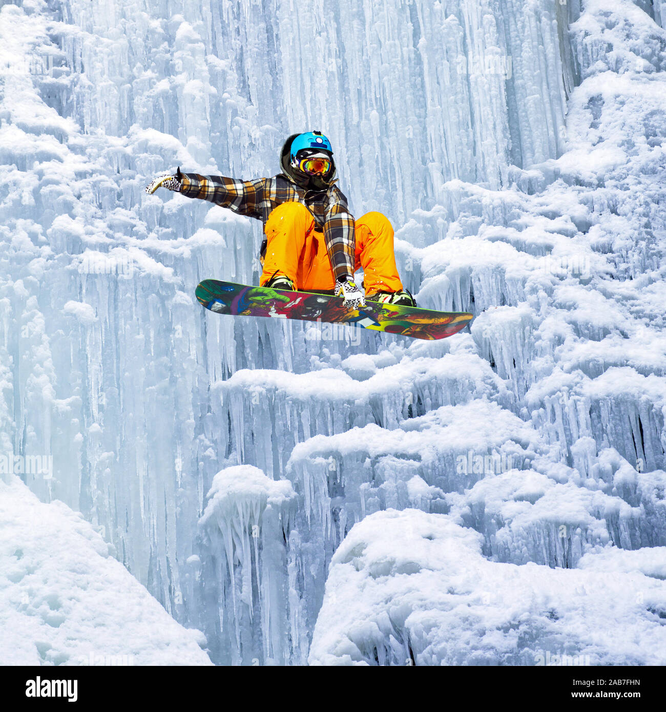 snowboarder jump of the icefall Stock Photo