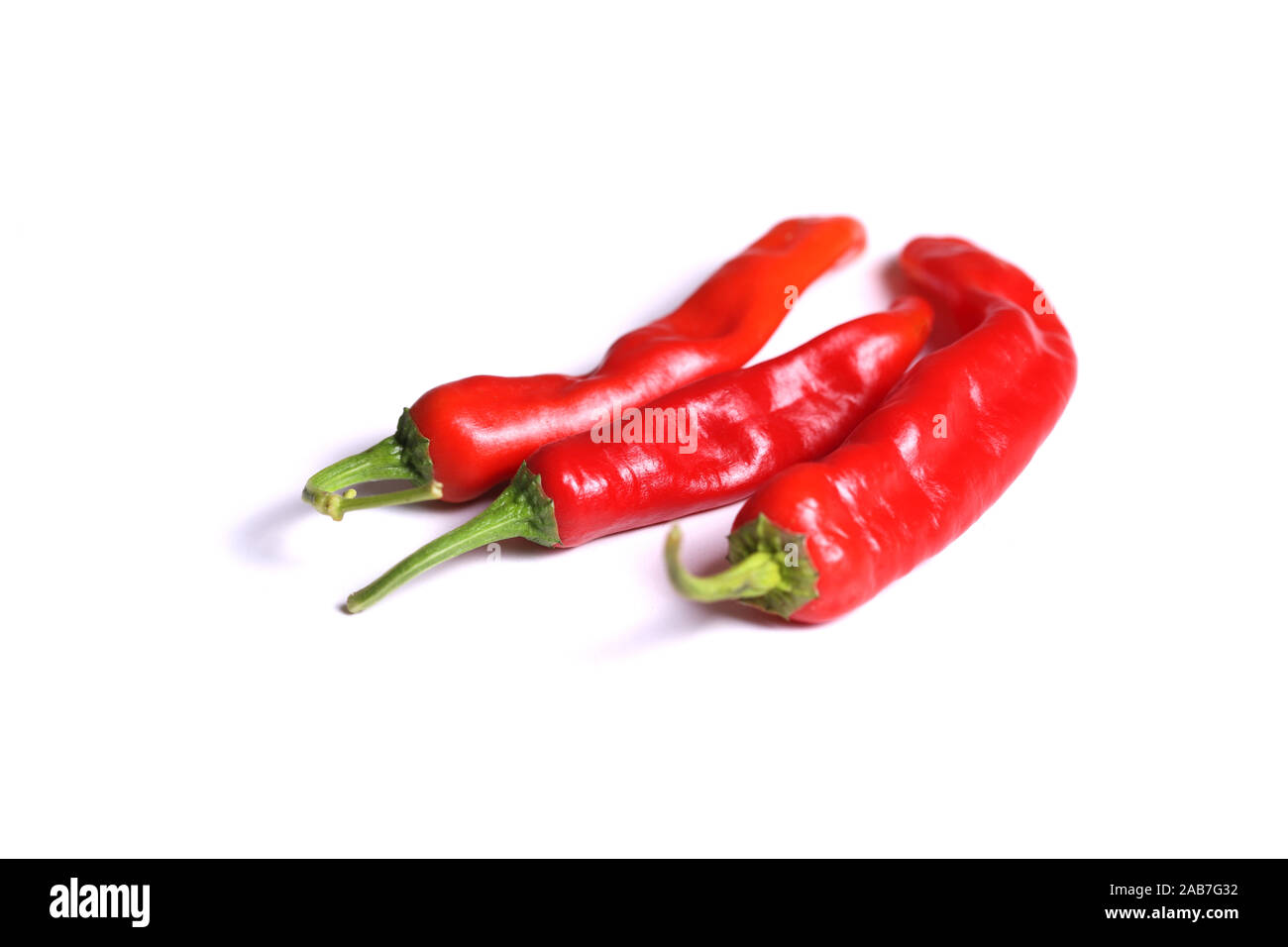 Red chili peppers isolated on white background Stock Photo - Alamy